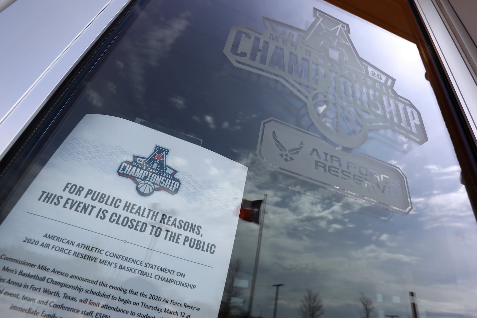 FILE - A sign is is displayed at an entrance to Dickies Arena at the American Athletic Conference tournament before the NCAA college basketball games were canceled due to coronavirus concerns, Thursday, March 12, 2020 in Fort Worth, Texas. (AP Photo/Richard Rodriguez, File)