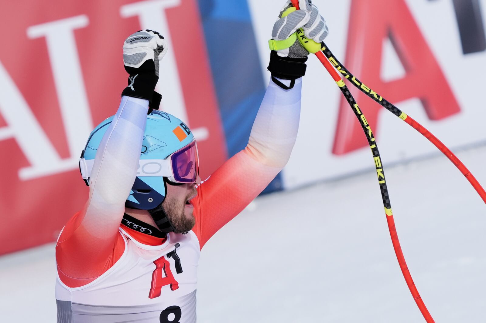 Switzerland's Alexis Monney celebrates at the finish area of a men's downhill race, at the Alpine Ski World Championships, in Saalbach-Hinterglemm, Austria, Sunday, Feb. 9, 2025. (AP Photo/Giovanni Auletta)