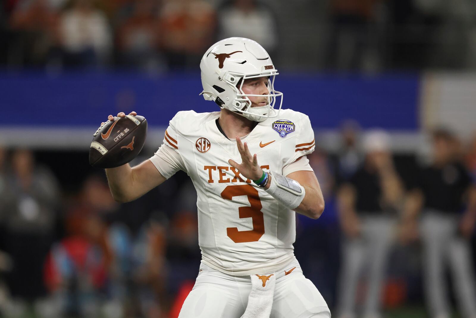 Texas quarterback Quinn Ewers (3) passes against Ohio State during the first half of the Cotton Bowl College Football Playoff semifinal game, Friday, Jan. 10, 2025, in Arlington, Texas. (AP Photo/Gareth Patterson)