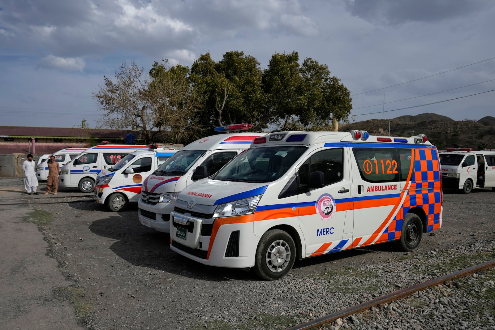 Ambulances park outside a railway station where rescued and injured passenger of a train attacked by insurgents are brought in Much, Pakistan's southwestern Balochistan province, Wednesday, March 12, 2025. (AP Photo/Anjum Naveed)