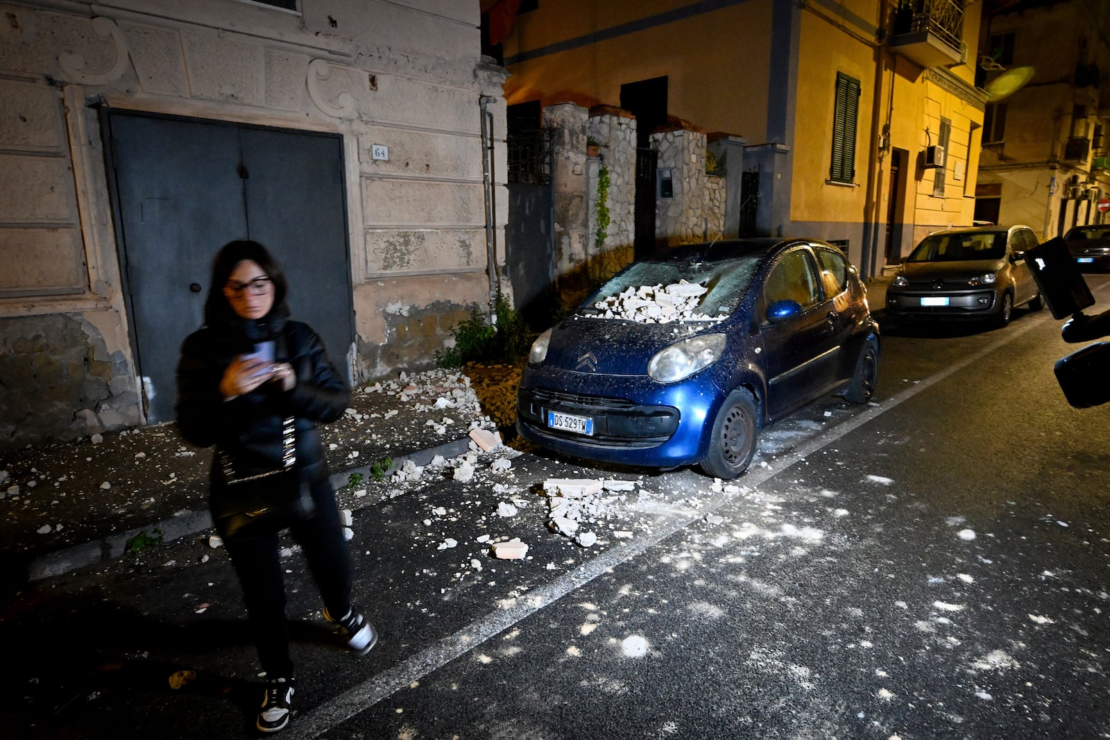 Debris on a car following an earthquake north of Naples, Italy, Thursday March 13, 2025. (Alessandro Garofalo/LaPresse via AP)