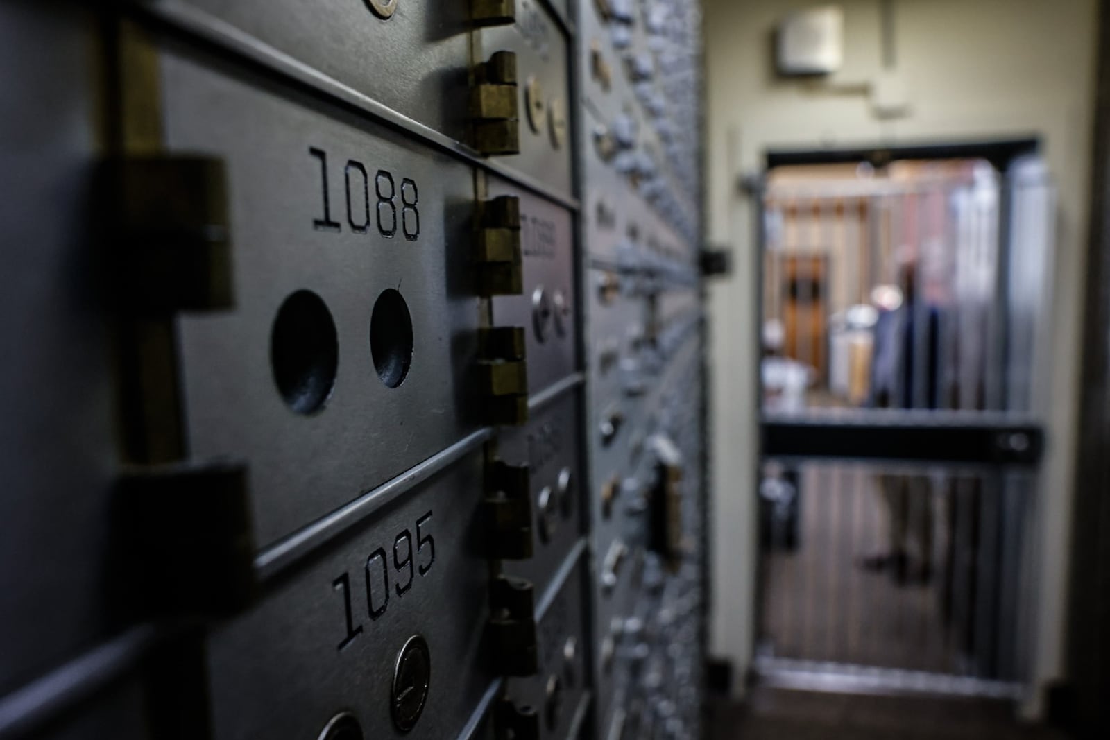 Safety deposit boxes line the entrance to the safe at the Farmers & Merchants Bank in Miamisburg. JIM NOELKER/STAFF