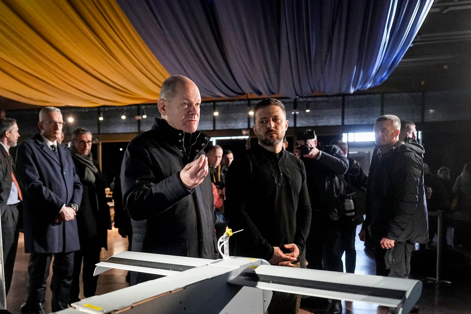 Ukraine's President Volodymyr Zelenskyy, right, and German Chancellor Olaf Scholz take a look at drones during Scholz's visit to Kyiv, Ukraine, Monday, Dec.2, 2024. (AP Photo/Efrem Lukatsky)