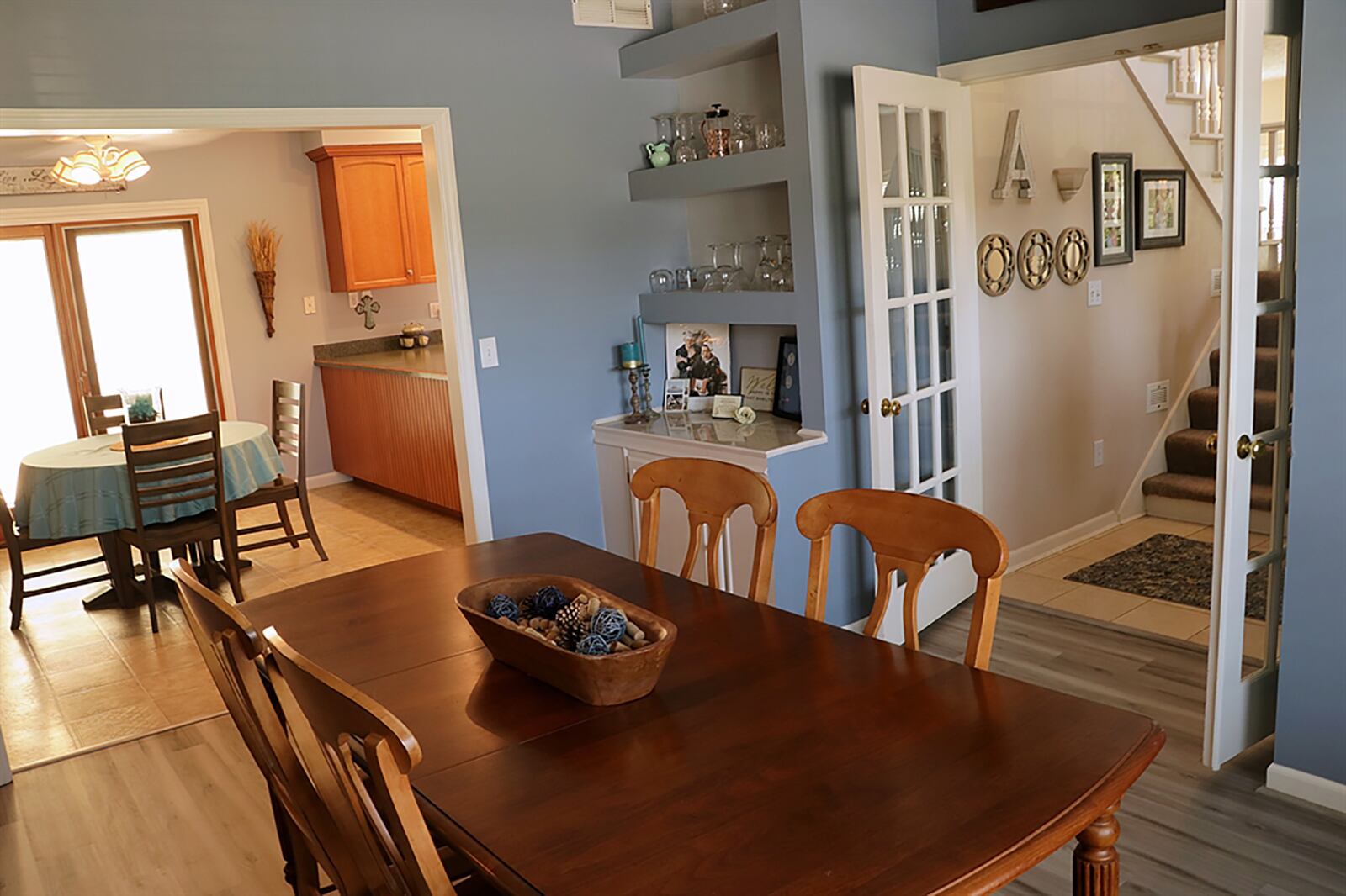 French doors open from the 2-story foyer into the formal dining room, which has a built-in buffet. CONTRIBUTED PHOTO BY KATHY TYLER