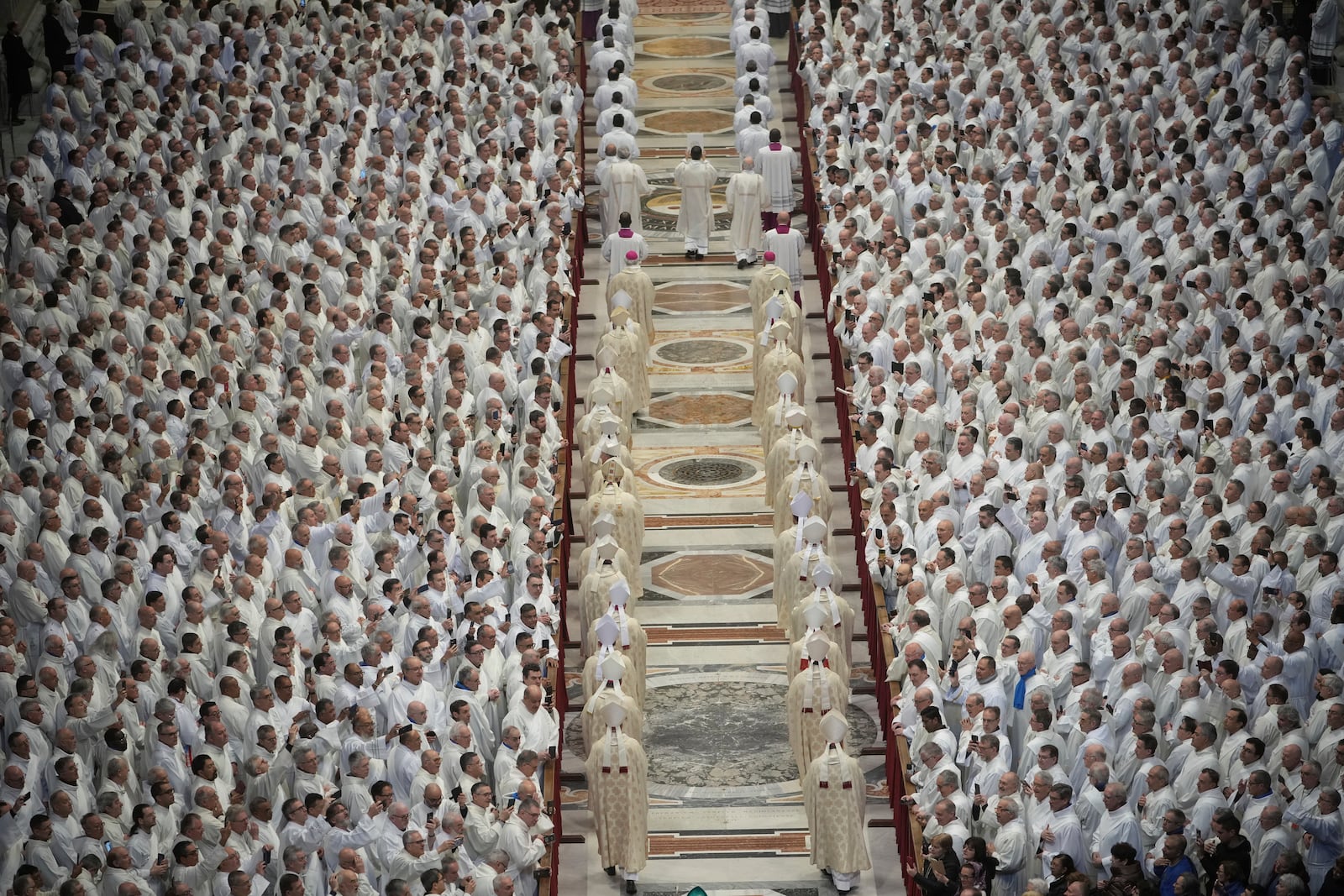 Deacons take part in a mass for their jubilee in St. Peter's Basilica at The Vatican that was supposed to be presided over by Pope Francis who was admitted over a week ago at Rome's Agostino Gemelli Polyclinic and is in critical conditions. (AP Photo/Alessandra Tarantino)