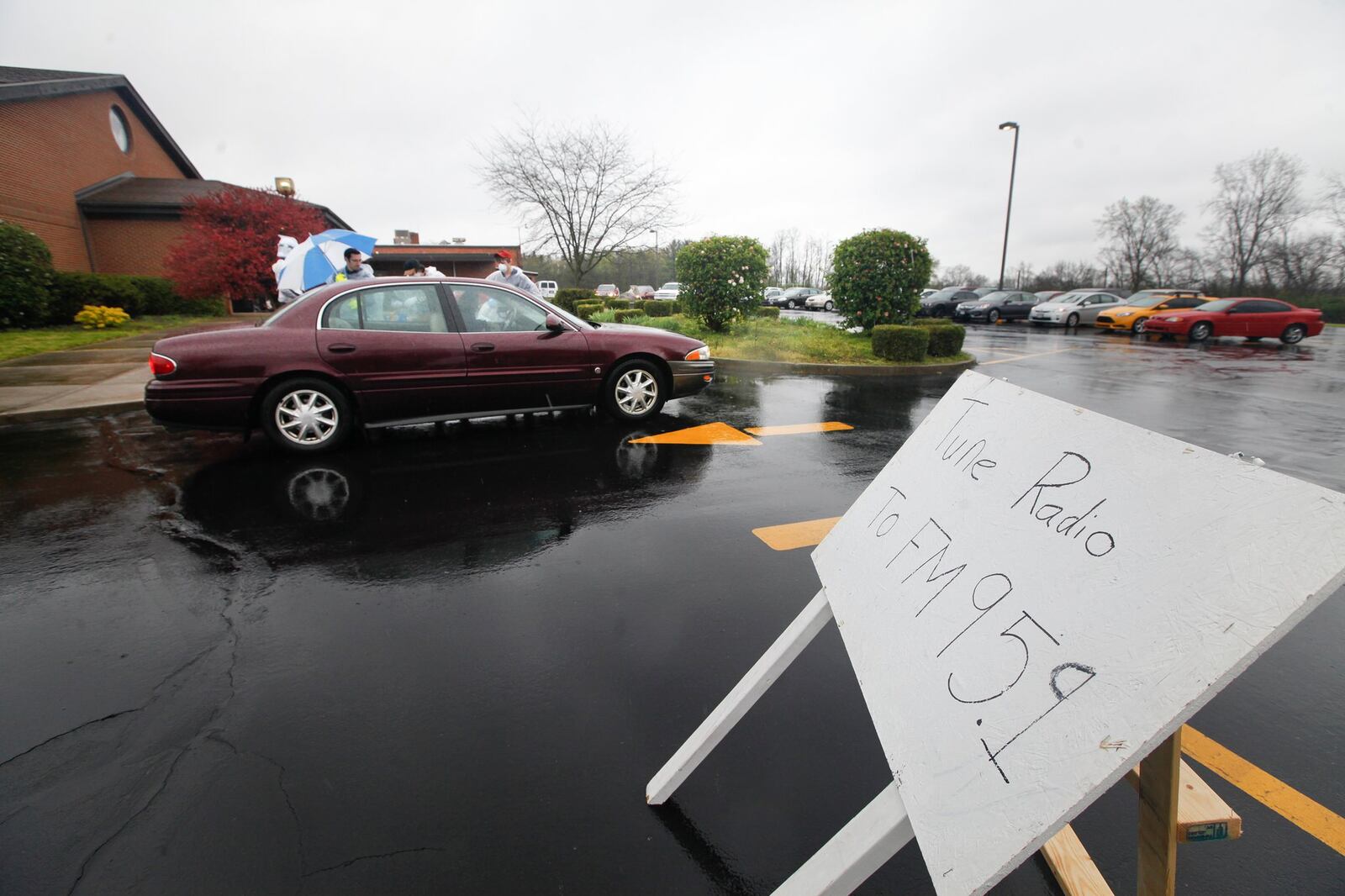 Members of First Grace Church in Butler Twp. met in the church parking lot but kept in their cars for the fourth Sunday in a row. CHRIS STEWART / STAFF