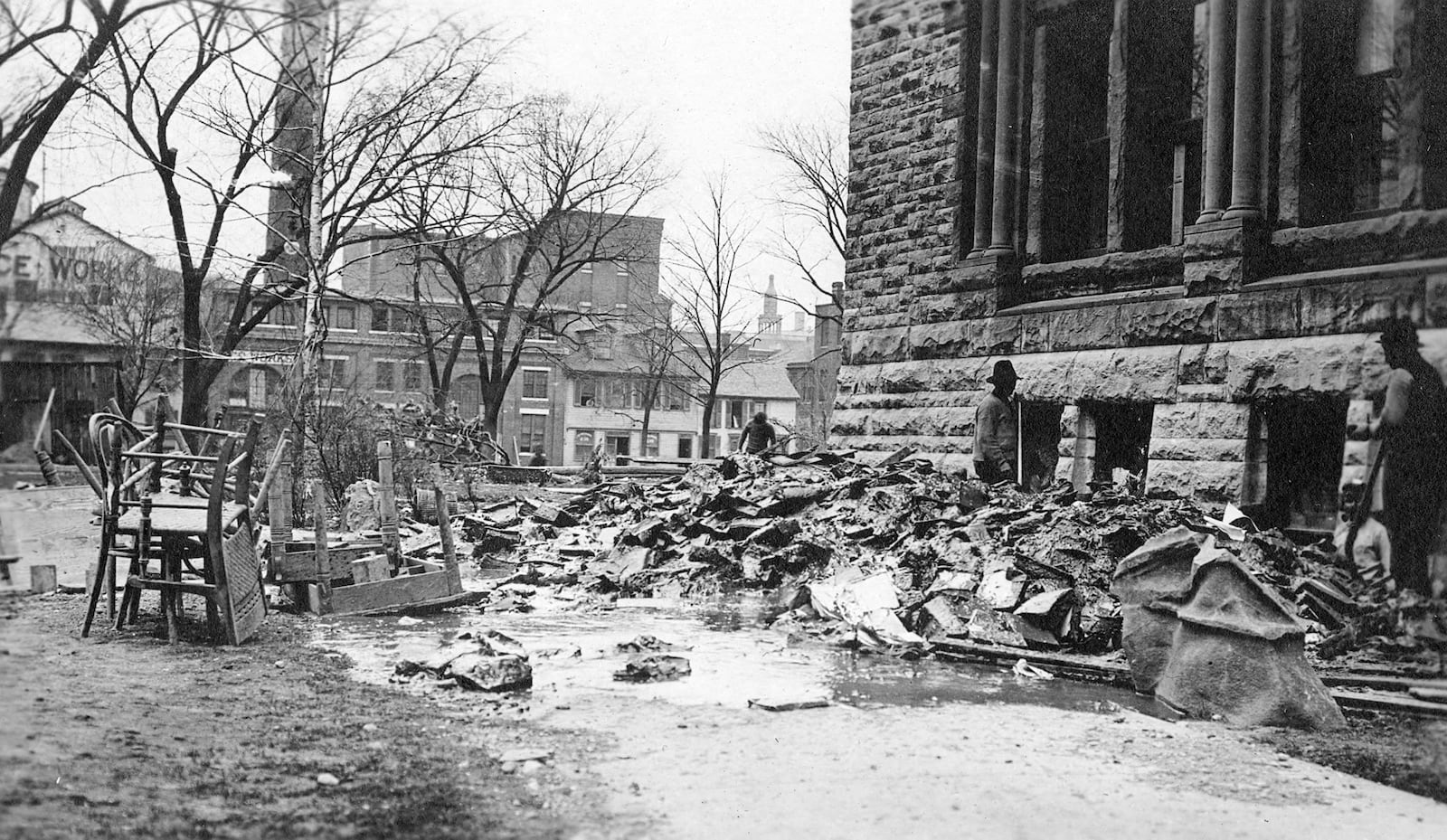 Books, destroyed in 1913 flood waters, were shoveled out of the Dayton Library. DAYTON METRO LIBRARY