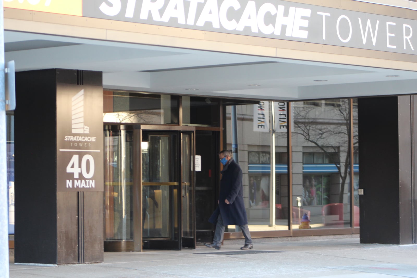 A man walks into Stratacache Tower, the office building Chris Riegel bought in 2019. 