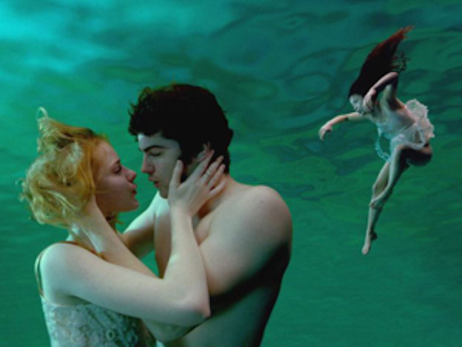 Evan Rachel Wood (left) as Lucy, Jim Sturgess (center) as Jude, and T.V. Carpio (right) as Prudence in Revolution Studios’ Across the Universe.