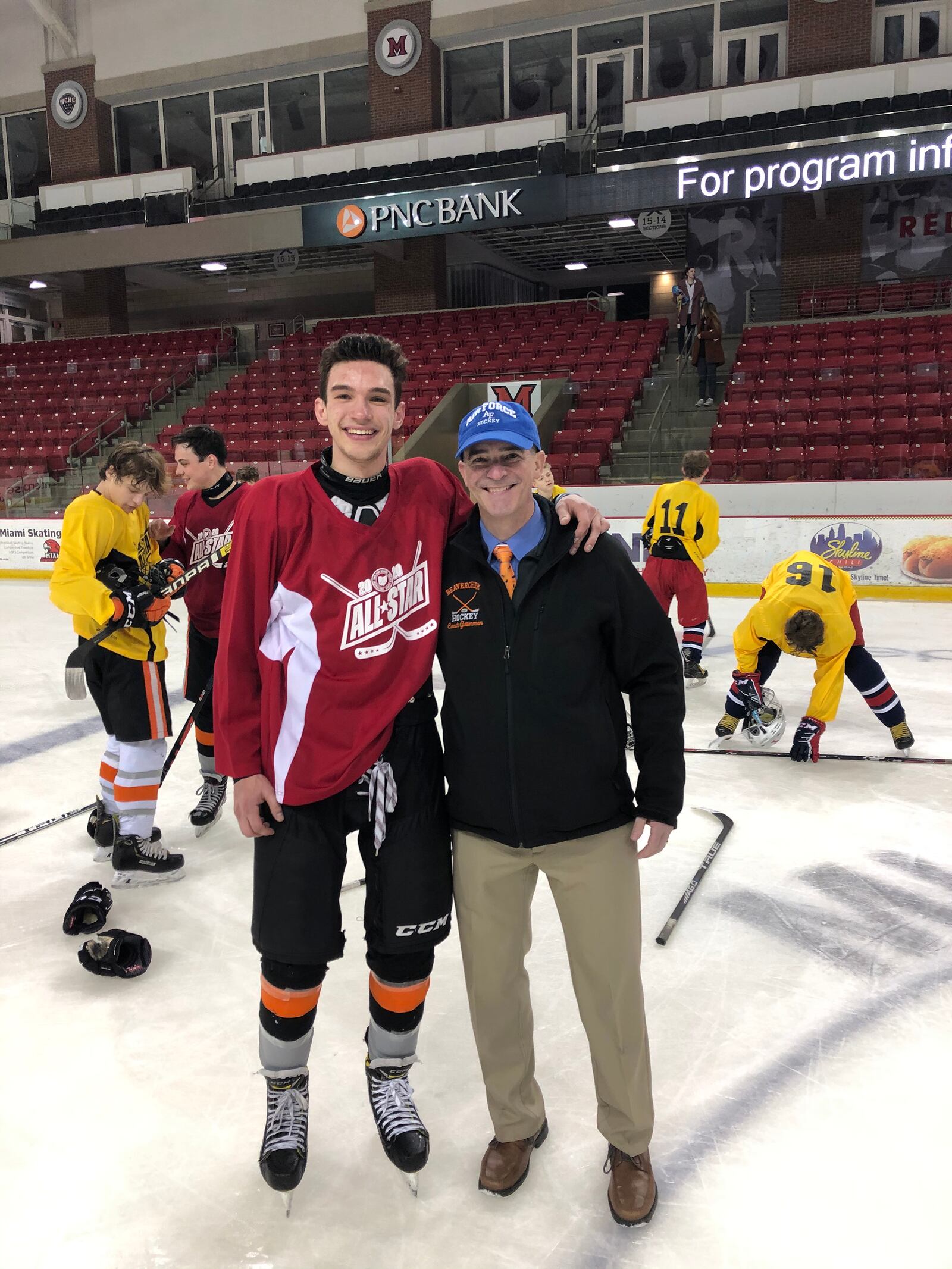 Greg Gutterman with his son Cole at the Southwest Ohio High School League All Star game, sponsored by the Academy Hockey Club. CONTRIBUTED