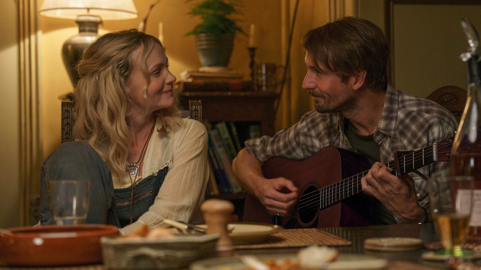 This image released by the Sundance Institute shows Carey Mulligan, left, and Tom Basden in a scene from "The Ballad of Wallis Island" by James Griffiths, an official selection of the 2025 Sundance Film Festival. (Alistair Heap/Sundance Institute via AP)