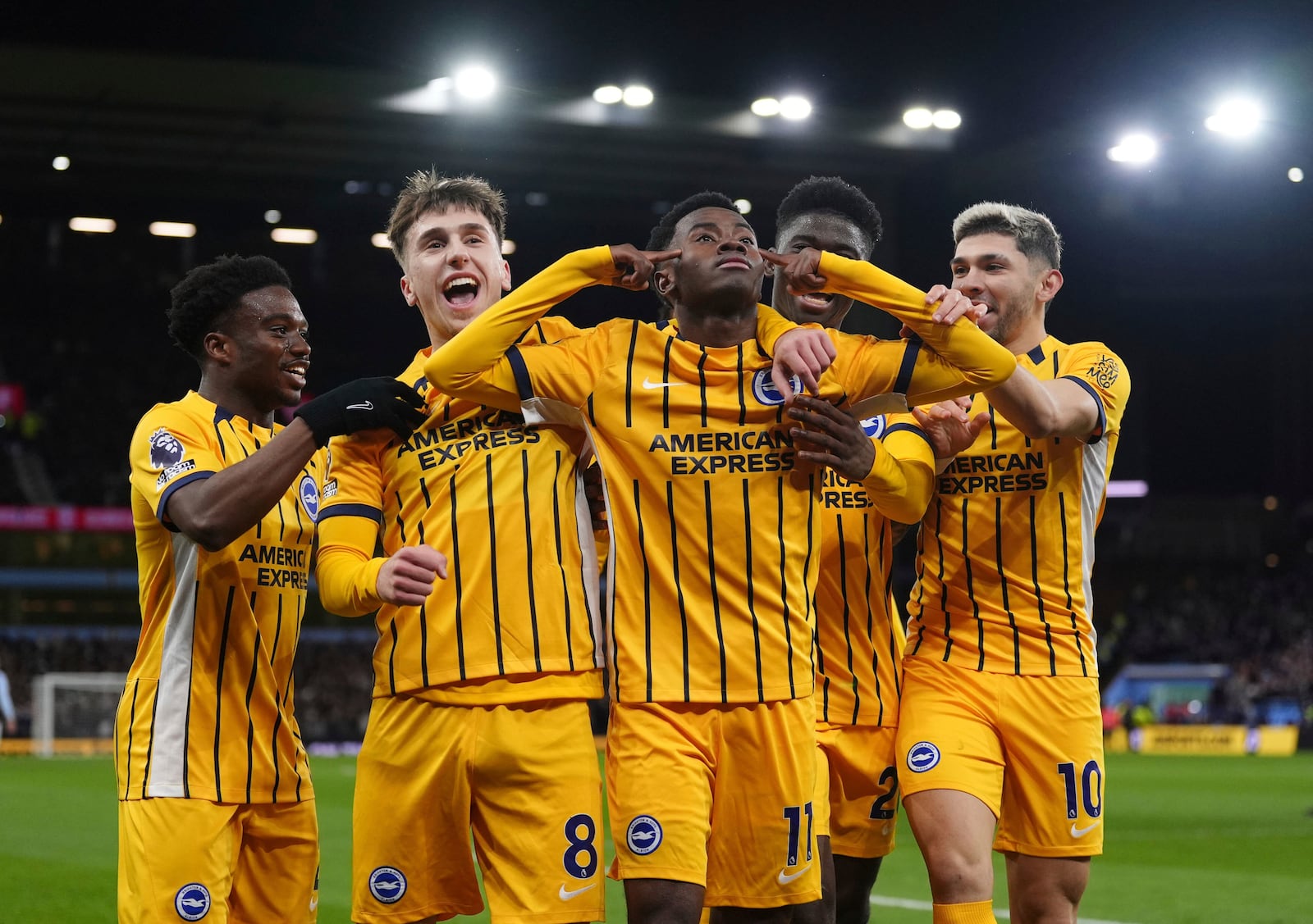 Brighton and Hove Albion's Simon Adingra celebrates scoring with teammates during the English Premier League soccer match between Aston Villa and Brighton and Hove Albion at Villa Park, Birmingham, England, Monday Dec. 30, 2024. (Bradley Collyer/PA via AP)