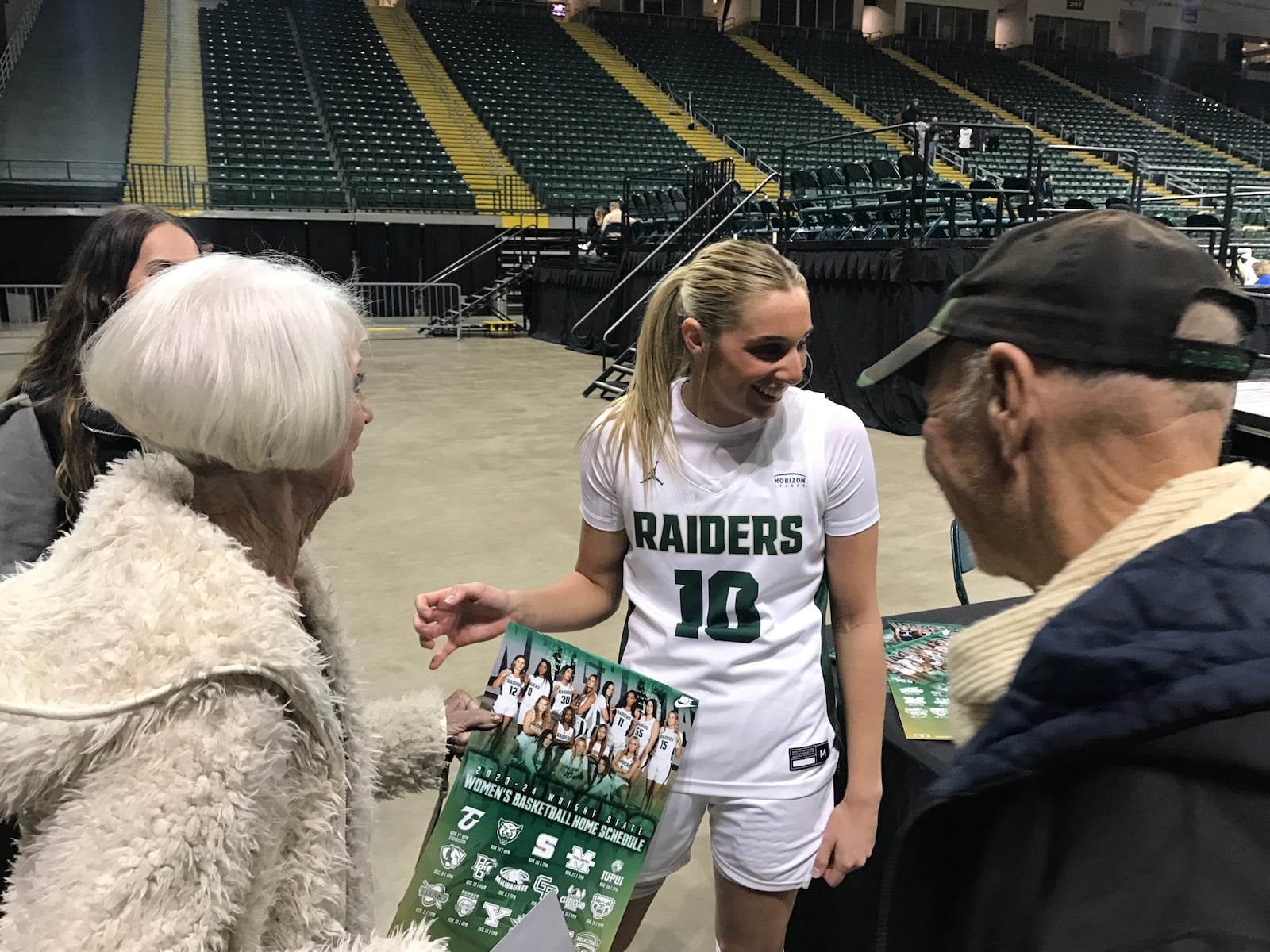 Wright State's Alexis Hutchison with her grandmother, Alma French, and Alma's boyfriend, Joe, after the game on Friday night at the Nutter Center. Tom Archdeacon/CONTRIBUTED