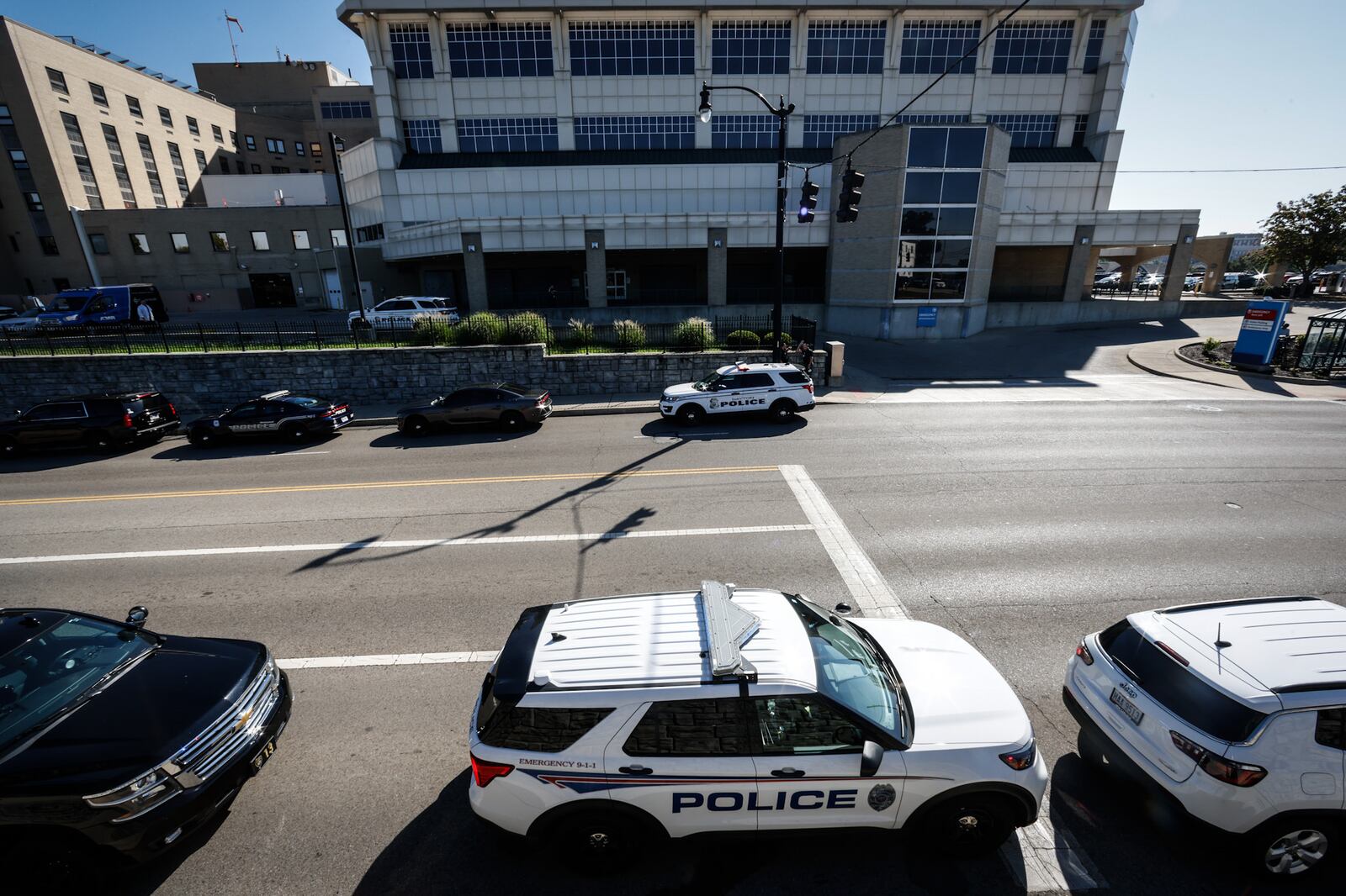 Richmond, Indiana, and Dayton police cruisers line the street Thursday, Sept. 1, 2022, near Miami Valley Hospital, where Richmond officer Seara Burton, shot Aug. 10 in the line of duty, was to be taken off life support. JIM NOELKER/STAFF