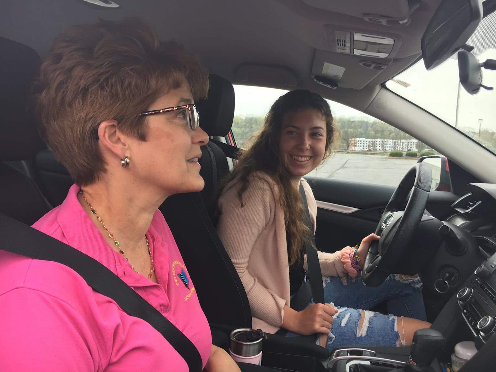 Braelen Devoe, a 16-year-old Centerville High School student, practices maneuverability with Sharon Fife, owner of D&D Driving School. Devoe said she doesn’t think the the state should pass a bill that would make teenagers hold their permit for a full year because teenagers need their driver’s licenses so their parents don’t have to taxi them around everywhere. STAFF PHOTO / HOLLY SHIVELY