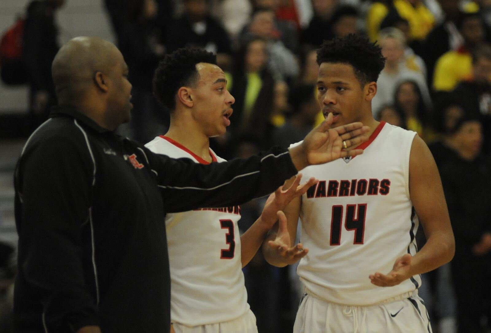 Wayne coach Travis Trice (left), Darius Quisenberry and Rashad McKee. Springfield defeated host Wayne 56-54 in a boys high school basketball game on Friday, Feb. 10, 2017. MARC PENDLETON / STAFF