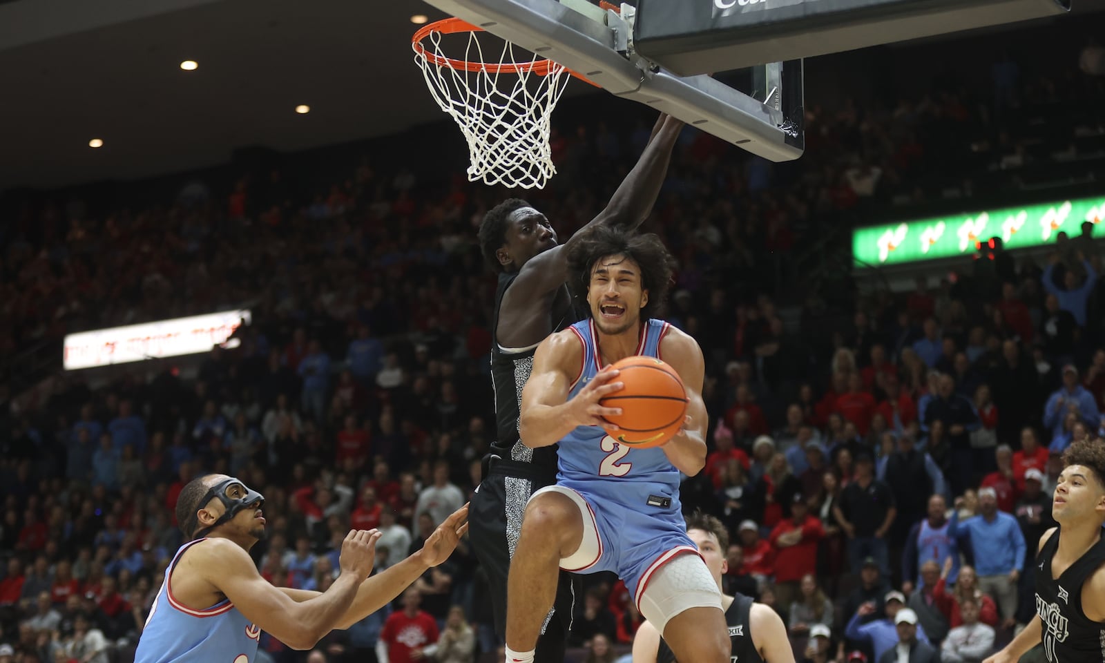 Dayton's Nate Santos drives to the basket but misses a reverse layup in the final minutes against Cincinnati on Friday, Dec. 20, 2024, at the Heritage Bank Center in Cincinnati.