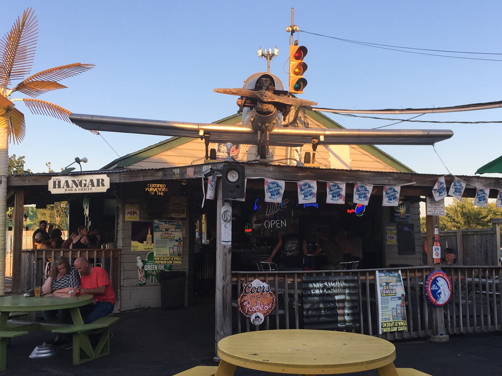 The plane atop The Hangar greets you as you enter the Wing Walker Patio.