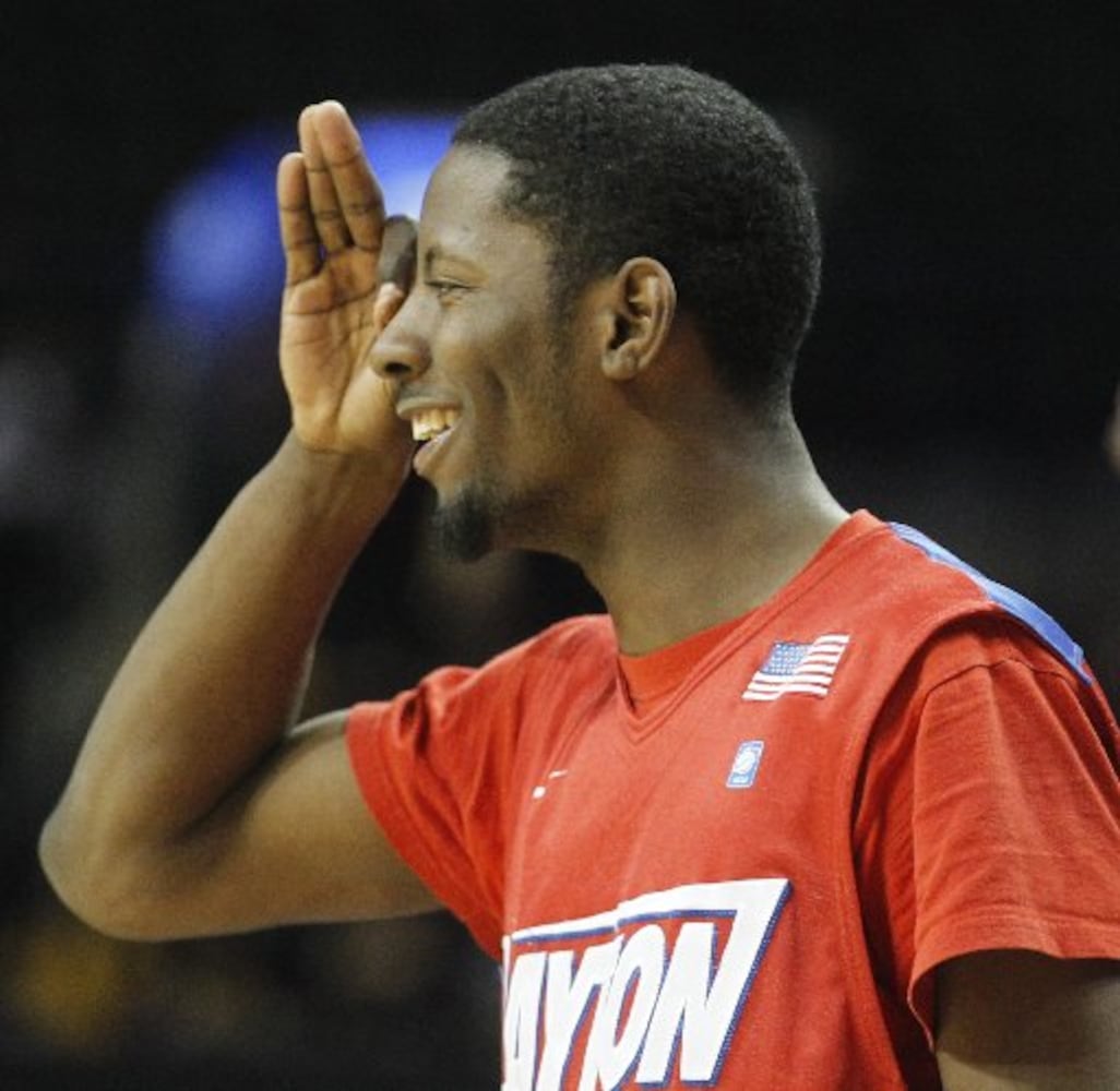 Dayton guard Scoochie Smith celebrates a basket against Saint Joseph's in the quarterfinals of the A-10 tournament on Friday, March 14, 2014, at the Barclays Center in Brooklyn, N.Y. David Jablonski/Staff