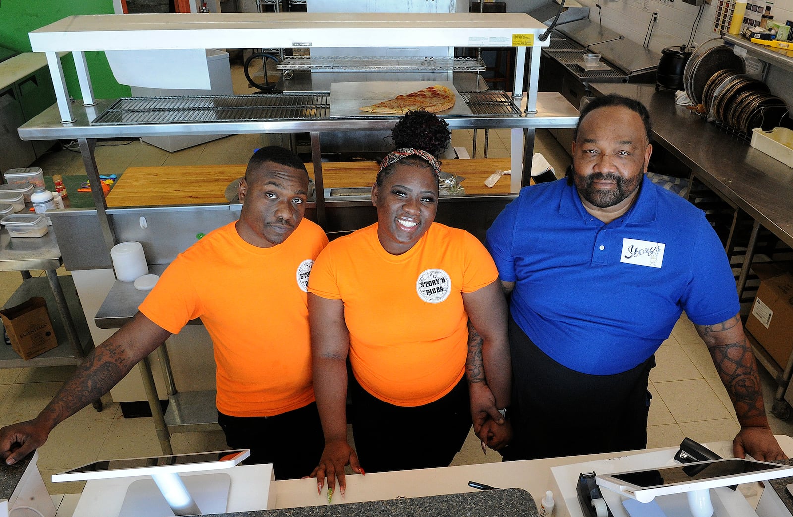 Story's Pizza & Smoothies is a family owned business located at 2741 West Alex Bell Road in Moraine. The Smith family from left, Cory, Ona, and their father, Steve, enjoy running the business. MARSHALL GORBY\STAFF