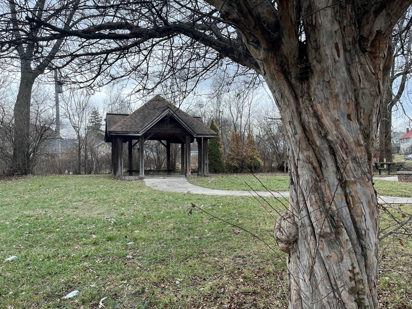 An underutilized park at 300 Delaware Ave. in the Five Oaks neighborhood in northwest Dayton.  The park has rotting wood seating and tables and has trash and litter near the gazebo. CORNELIUS FROLIK / STAFF