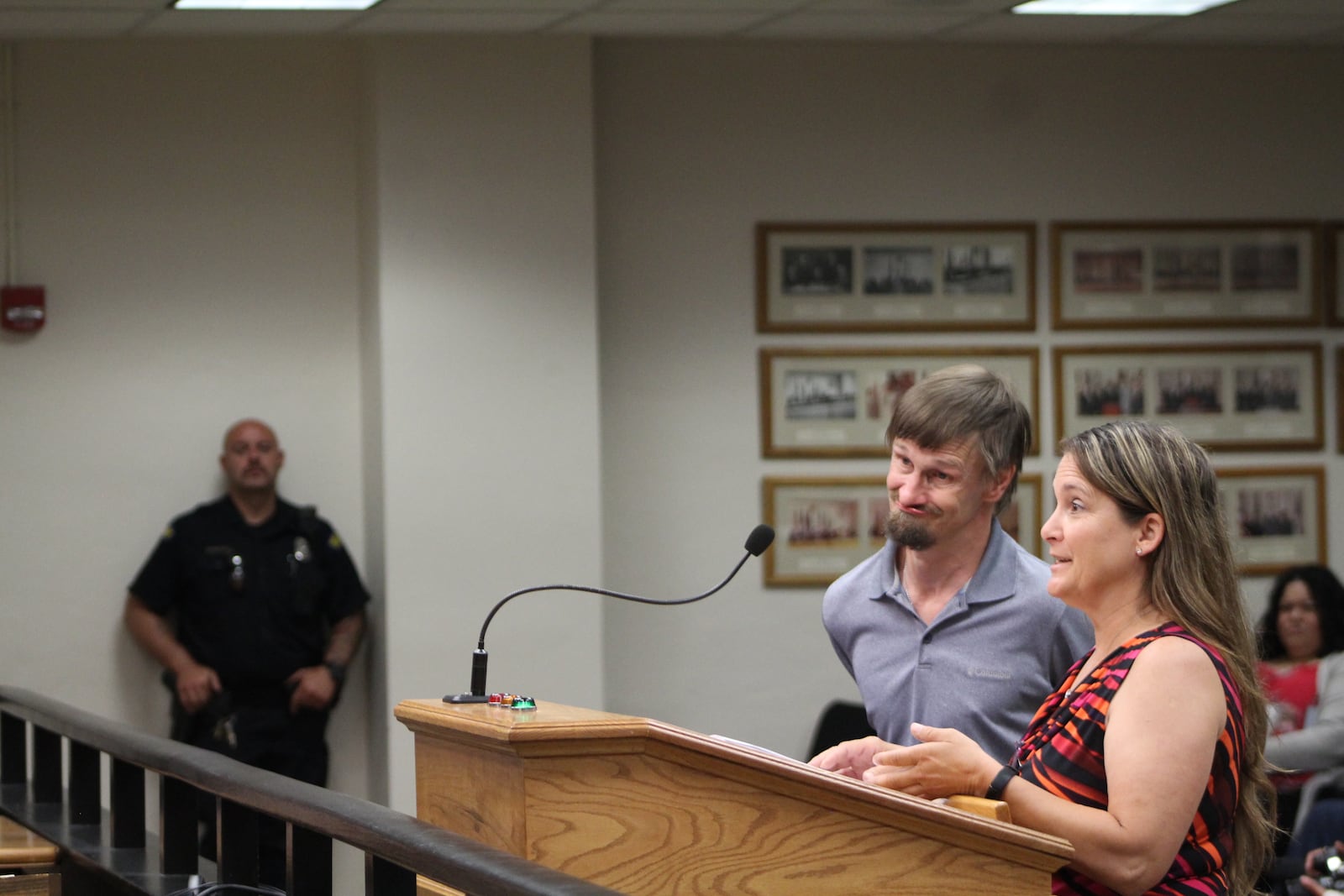 Debra Southard speaks for Jack Runser at a Dayton City Commission meeting. Runser has sued the city claiming he was mistreated by police. CORNELIUS FROLIK / STAFF