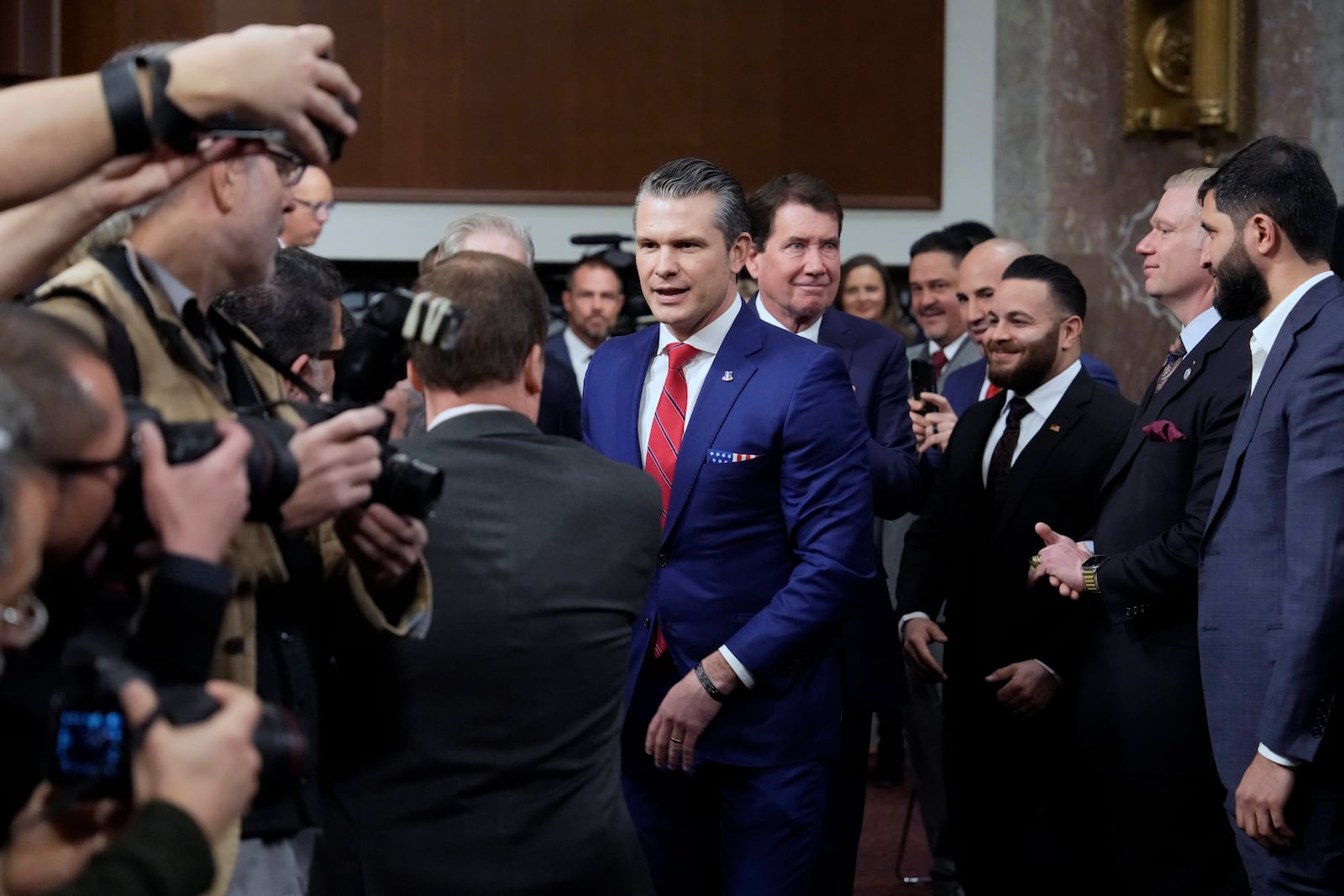 Pete Hegseth, President-elect Donald Trump's choice to be Defense secretary, arrives before the Senate Armed Services Committee for his confirmation hearing, at the Capitol in Washington, Tuesday, Jan. 14, 2025. (AP Photo/Ben Curtis)