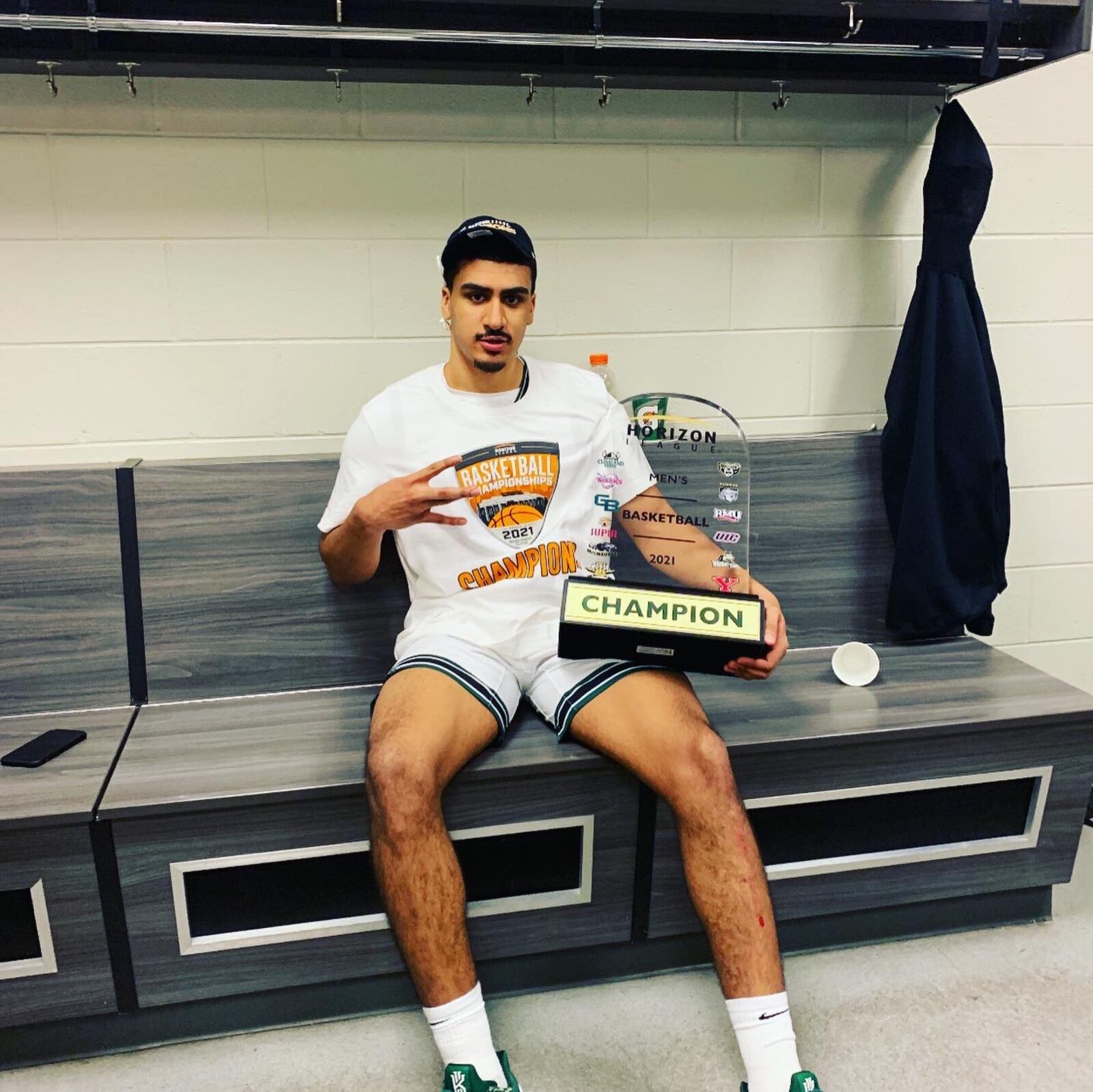 Torrey Patton with the Horizon League championship trophy in dressing room after his Cleveland State Vikings beat Oakland to win the Horizon League Tournament and advance to the NCAA Tournament. He was voted the MVP of the Horizon League Tournament. CONTRIBUTED