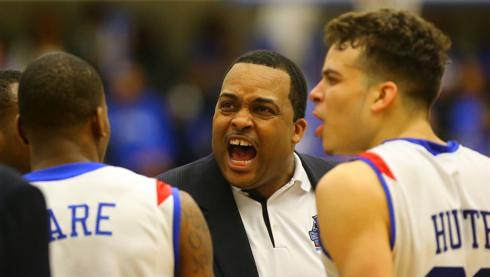 030715 ATLANTA: Georgia State head coach Ron Hunter and his son R.J. Hunter (right) fire up the team during a time out against Georgia Southern during a basketball game on the way to winning the Sunbelt Men’s Basketball Regular Season Championship on Saturday, March 7, 2015, in Atlanta. Curtis Compton / ccompton@ajc.com