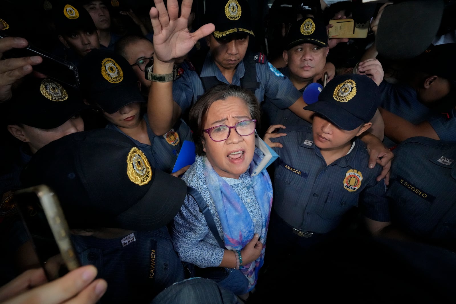 FILE- Former Senator Leila de Lima, one of the most vocal critics of former president Rodrigo Duterte, leaved the Muntinlupa City trial court after she was released on bail on Monday, Nov. 13, 2023 in Muntinlupa, Philippines. (AP Photo/Aaron Favila, File)