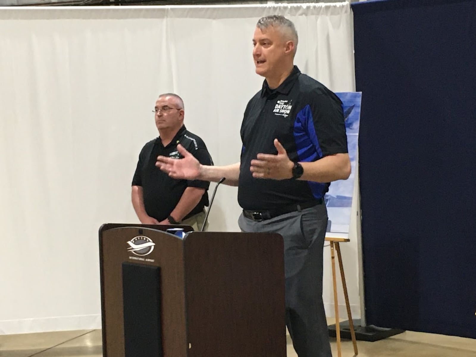 Kevin Franklin, the new executive director of the CenterPoint Energy Dayton Air Show (left), with Scott Buchanan, the show's chairman, at the podium. THOMAS GNAU/STAFF