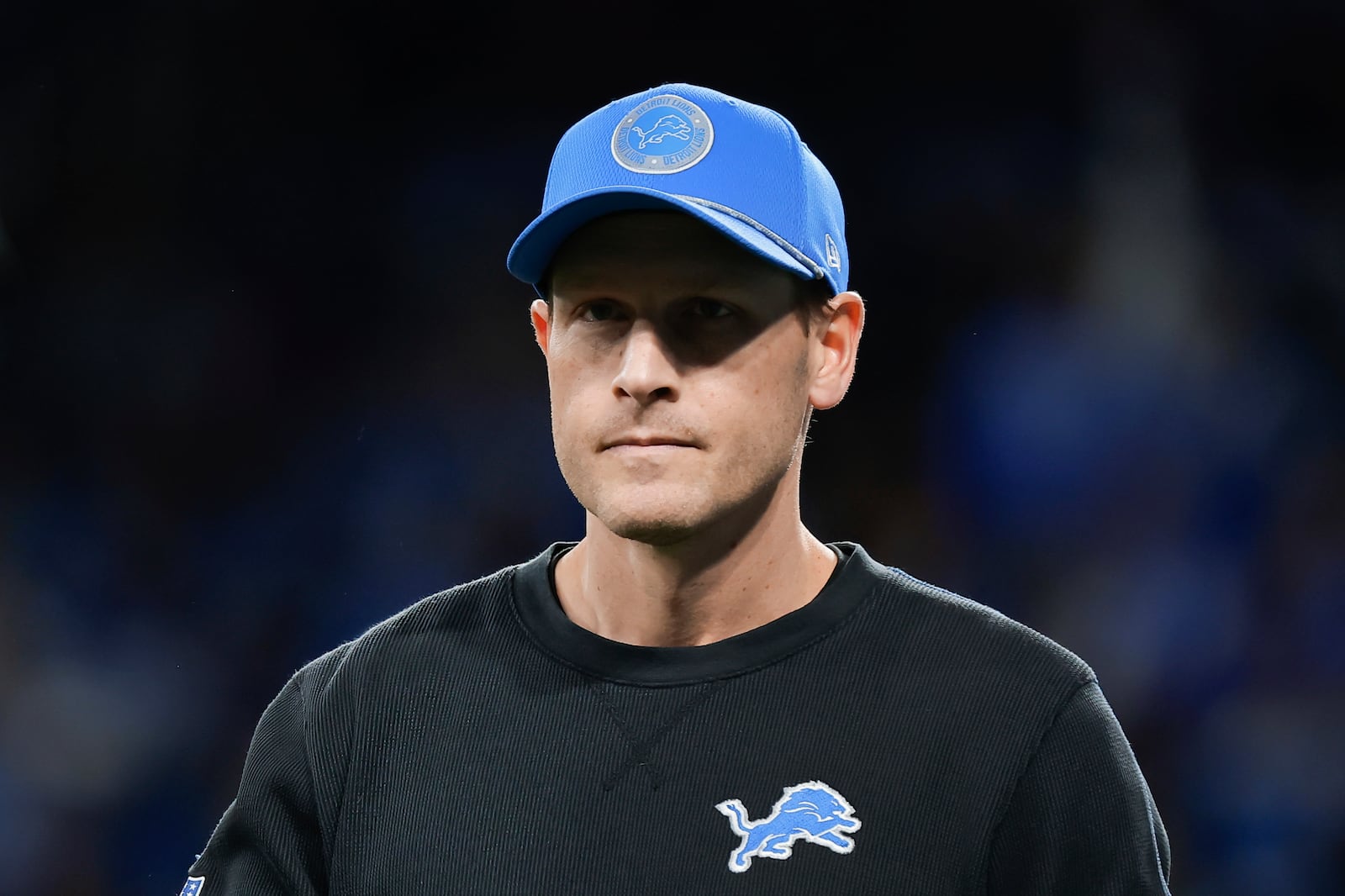 Detroit Lions offensive coordinator Ben Johnson watches during warmups before an NFL football divisional playoff game against the Washington Commanders, Saturday, Jan. 18, 2025, in Detroit. (AP Photo/Rey Del Rio)