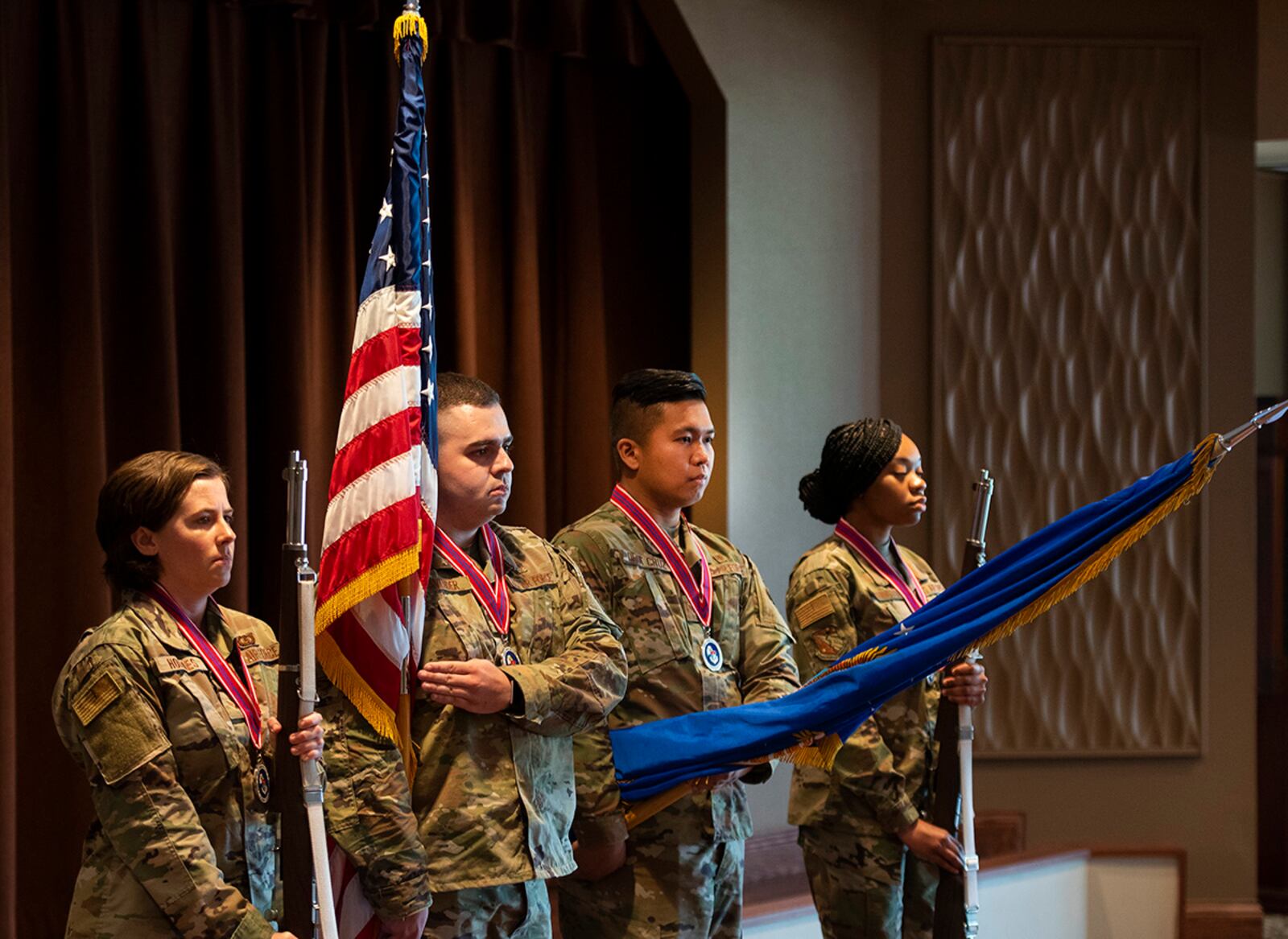 An honor guard made up of Airman Leadership School Class 21-E members posts colors during the start of their graduation ceremony June 17 at Wright-Patterson Air Force Base. The class of 23 junior Airmen was trained in skills needed as they move into the NCO ranks. U.S. AIR FORCE PHOTO/R.J. ORIEZ