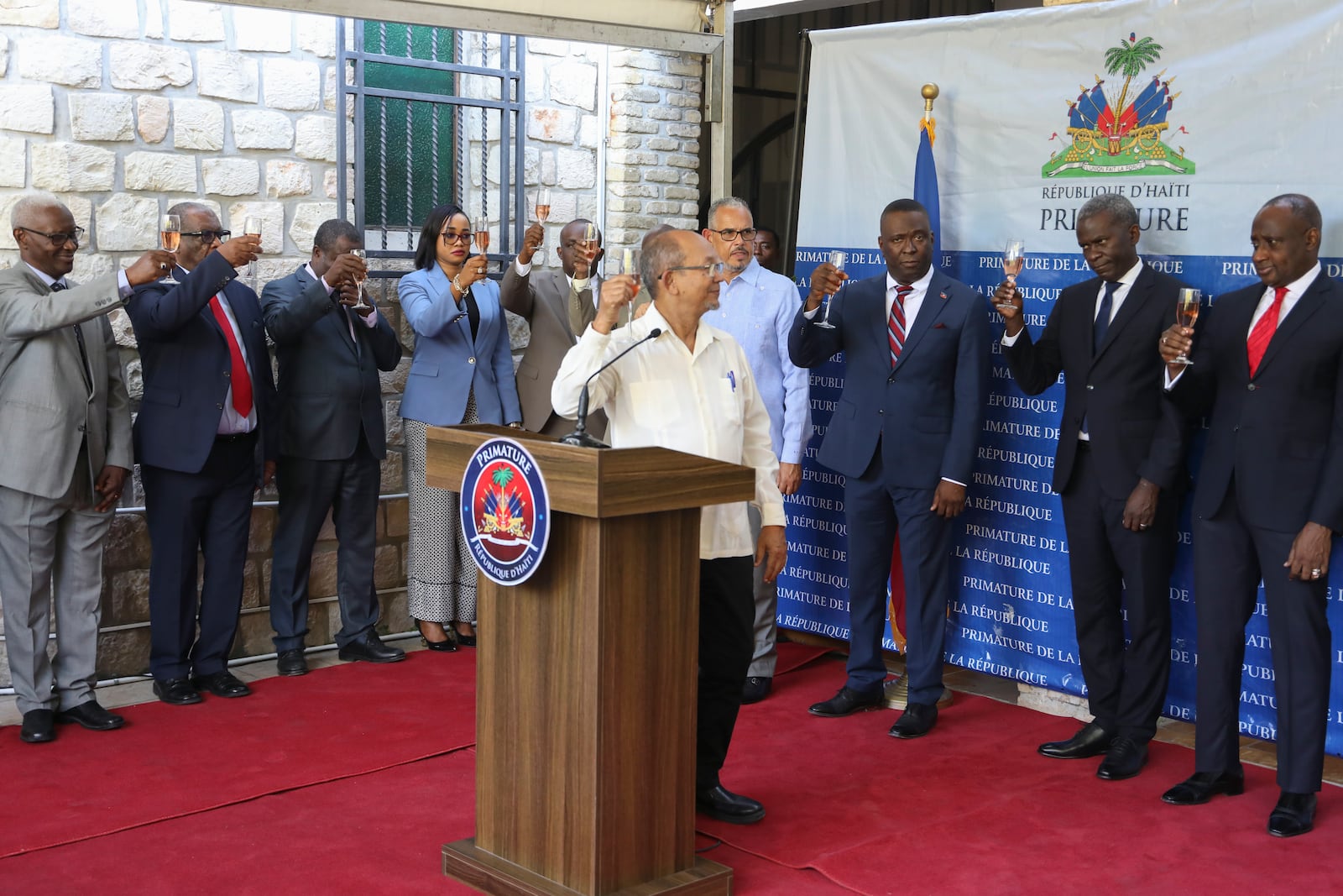 Transitional Presidential Council President Leslie Voltaire toasts during the inauguration of Secretary of State for Public Security Mario Andresol in Port-au-Prince, Haiti, Tuesday, Jan. 14, 2025. (AP Photo/Odelyn Joseph)