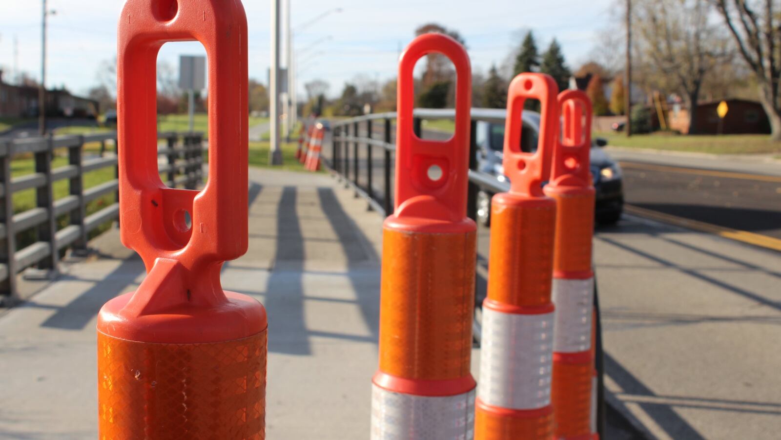 Orange plastic cones were placed on either ends of the Stroop Road bridge in Kettering. The bridge is expected to be replaced next year. CORNELIUS FROLIK / STAFF