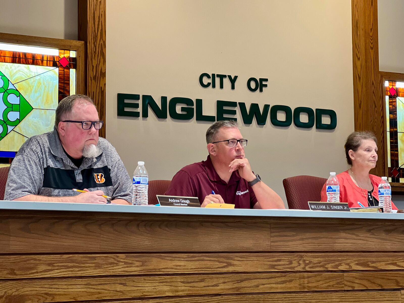 The Englewood Planning Commission and Development Director Bill Singer, center, heard from representatives of Wawa gas station Thursday evening, who made a case for why the body should recommend city council approval of a proposal to construct a new specialty store in Englewood, near Miami Valley Hospital North Campus. AIMEE HANCOCK/STAFF