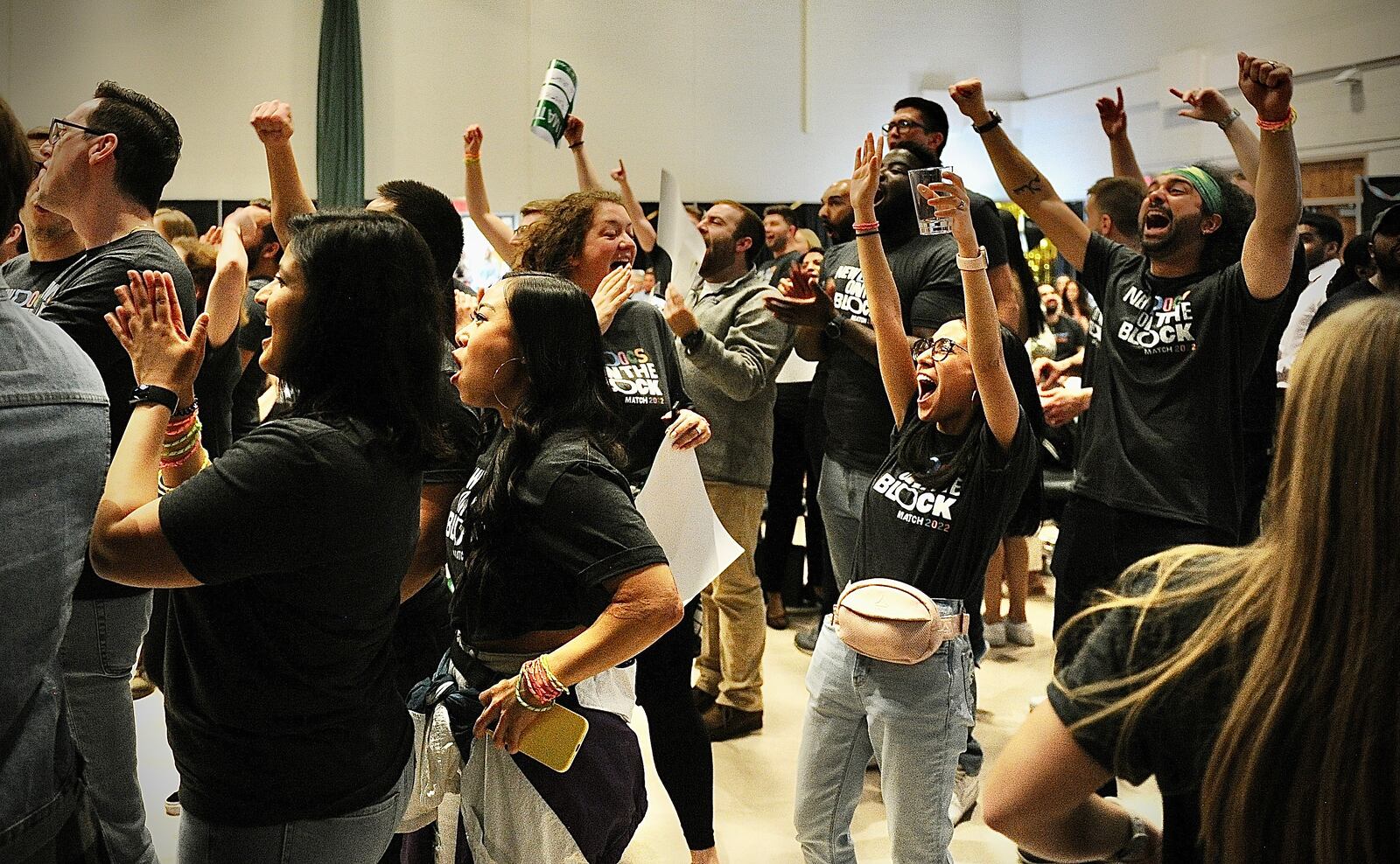 Wright State University Medical students cheer and celebrate for other students during Match Day Friday March 18, 2022. MARSHALL GORBY\STAFF