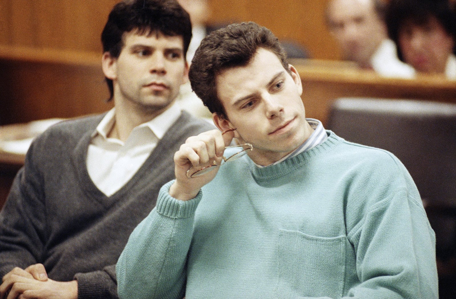 FILE - Lyle, left, and Erik Menendez appear in court for a preliminary hearing held in Beverly Hills, Calif., April 12, 1991. (AP Photo/Kevork Djansezian)