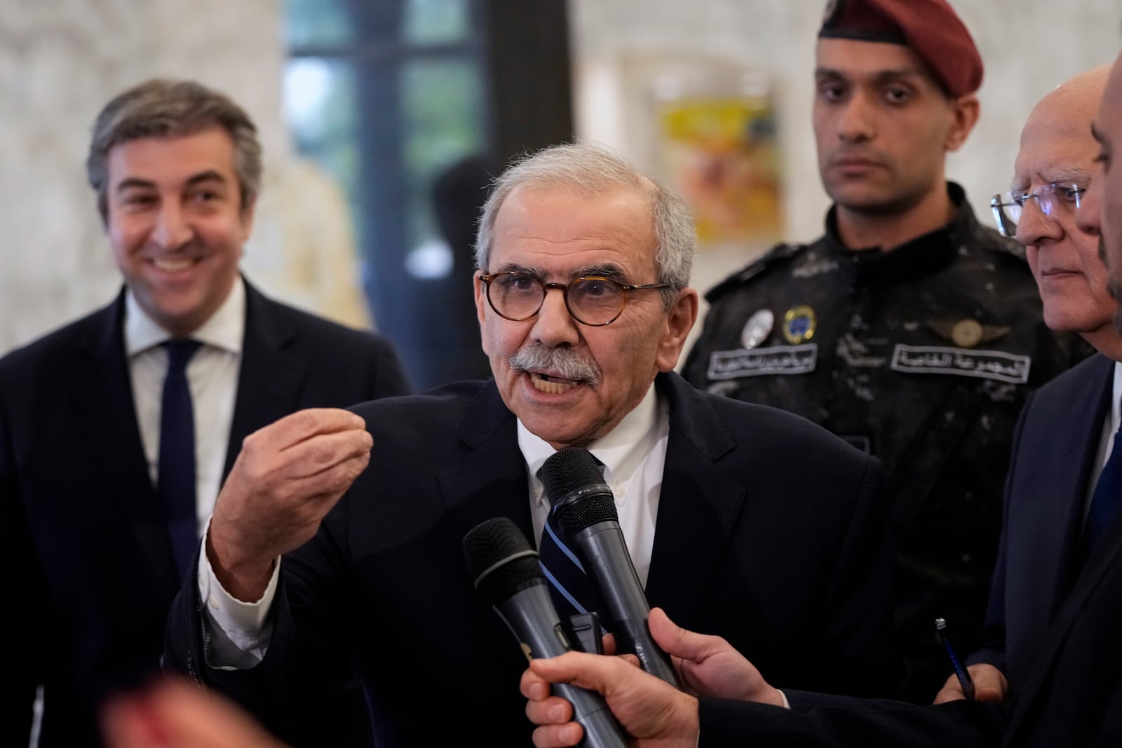 Lebanese Prime Minister-designate Nawaf Salam speaks to journalists after his meeting with Lebanese President Joseph Aoun at the presidential palace in Baabda, east of Beirut, Lebanon, Tuesday, Jan. 14, 2025. (AP Photo/Hassan Ammar)