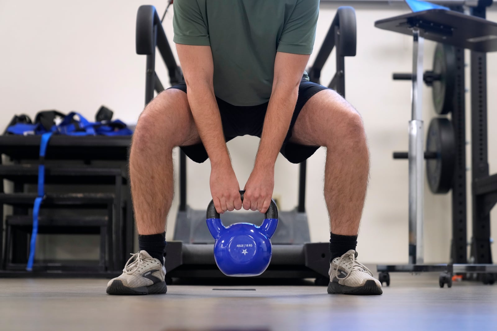 Jacob Bullard lifts a weight as part of his physical therapy at WashU, Monday, Dec. 16, 2024, in St. Louis. (AP Photo/Jeff Roberson)