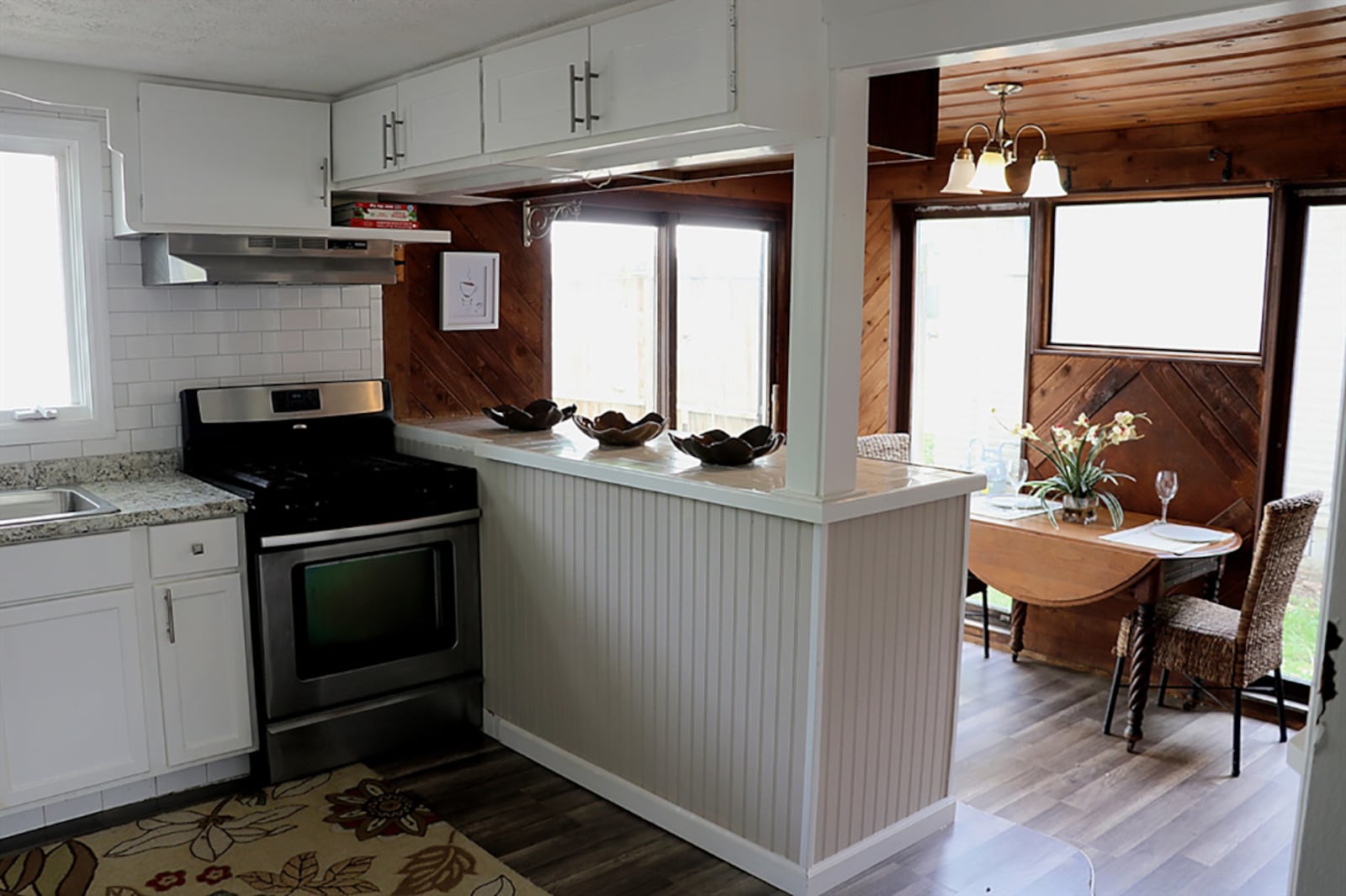 A step down from the kitchen is a quaint breakfast room or sunny sitting room as tall windows flank a frosty picture window. Knotty-pine, tongue-and-groove paneling accents the breakfast room walls and ceiling. CONTRIBUTED PHOTO BY KATHY TYLER