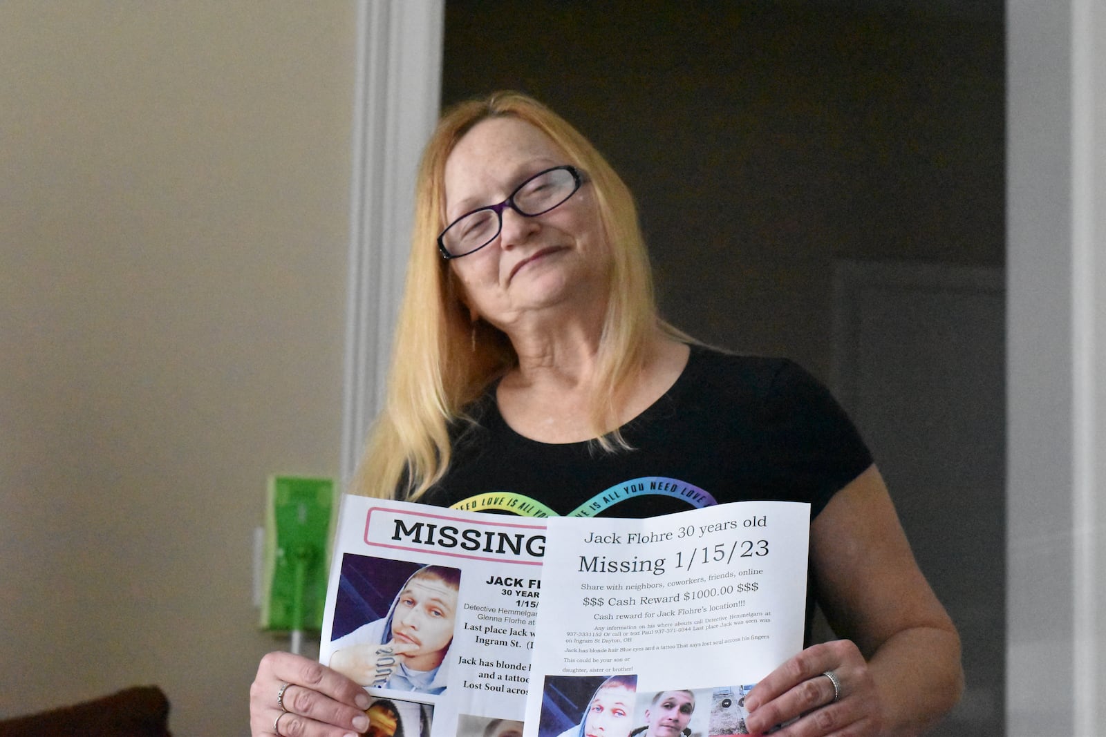 Glenna Flohre holds missing posters for her son, Jack Flohre. Jack Flohre has not been seen since Jan. 15, 2023. His mother and a friend fear he may be dead or he's being held against his will. CORNELIUS FROLIK / STAFF