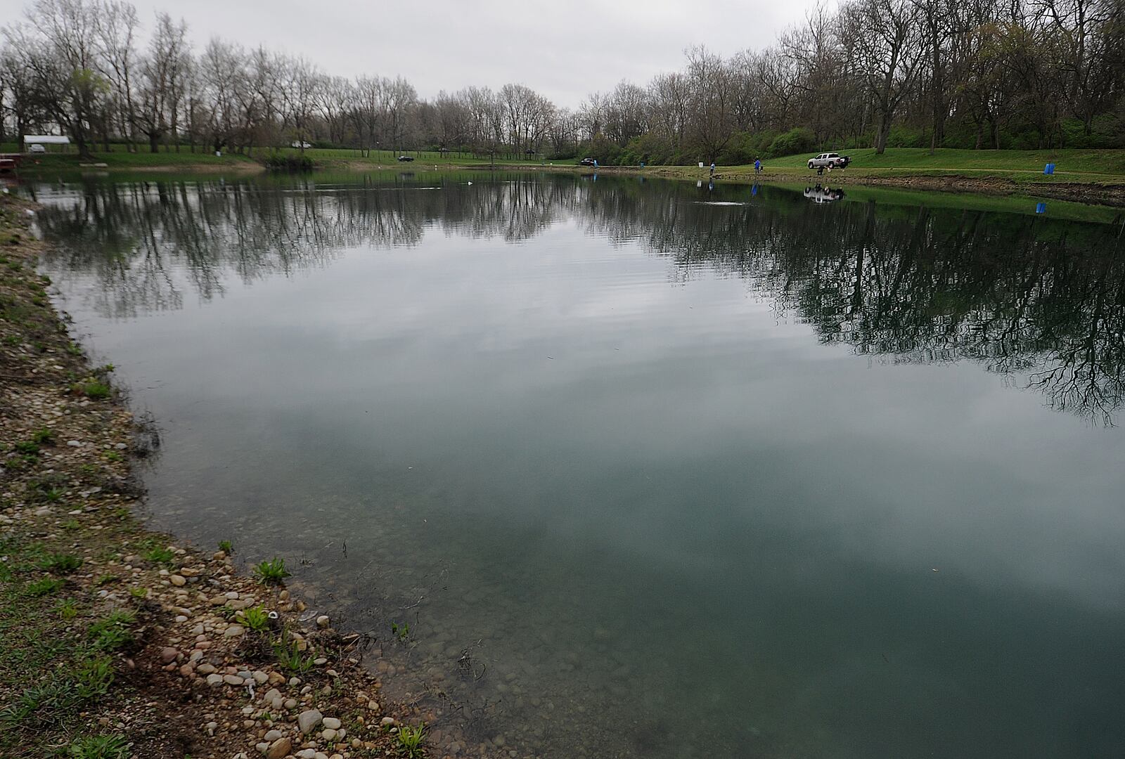 People come to Rainbow Lakes in Fairborn to relax and fish on Wednesday, April 10, 2024. MARSHALL GORBY\STAFF