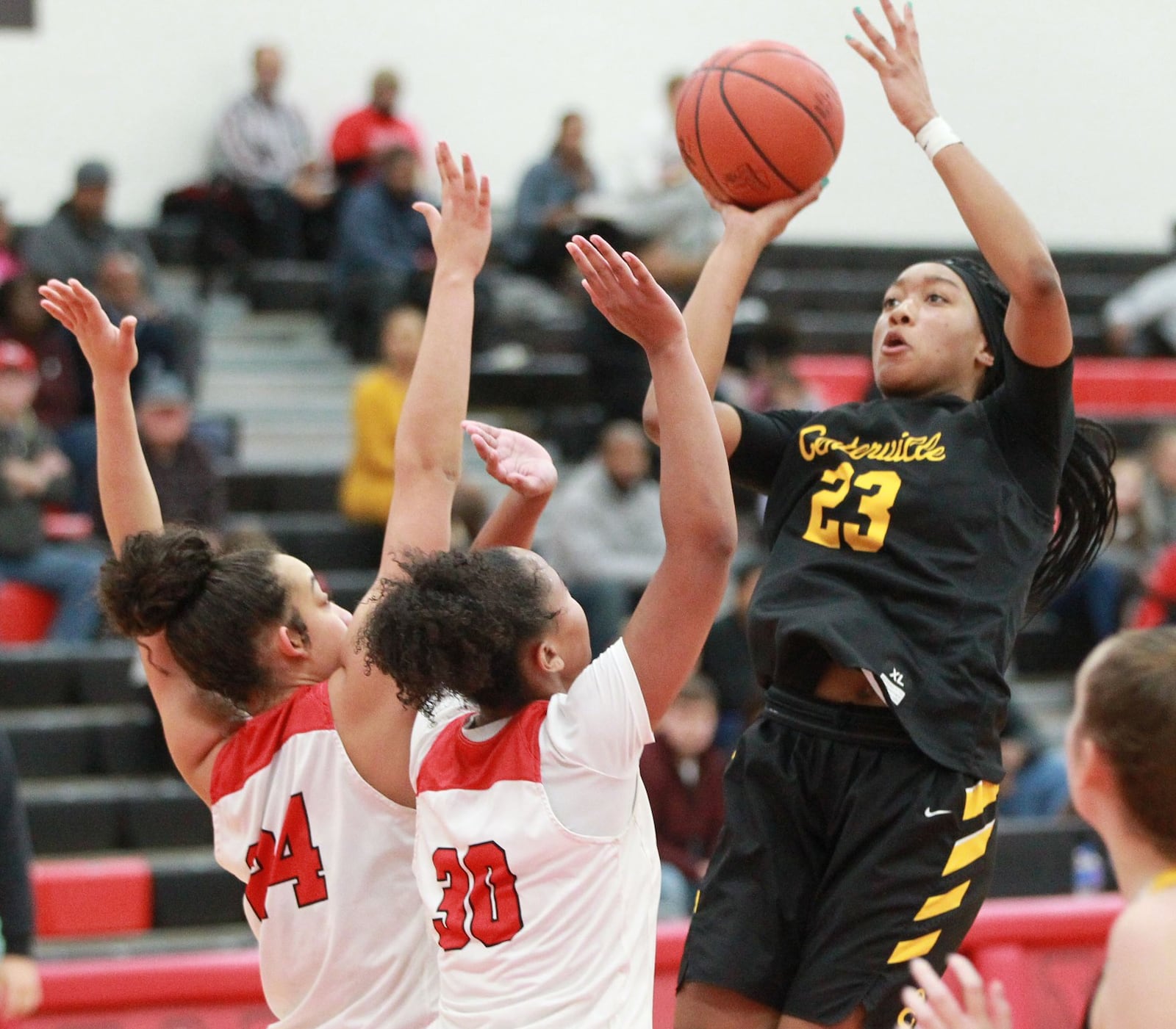 Cotie McMahon of Centerville shoots over Wayne defenders Jaida Wolfork (left) and Lovie Malone. Wayne defeated visiting Centerville 56-37 in a GWOC girls high school basketball game on Wednesday, Dec. 11, 2019. MARC PENDLETON / STAFF