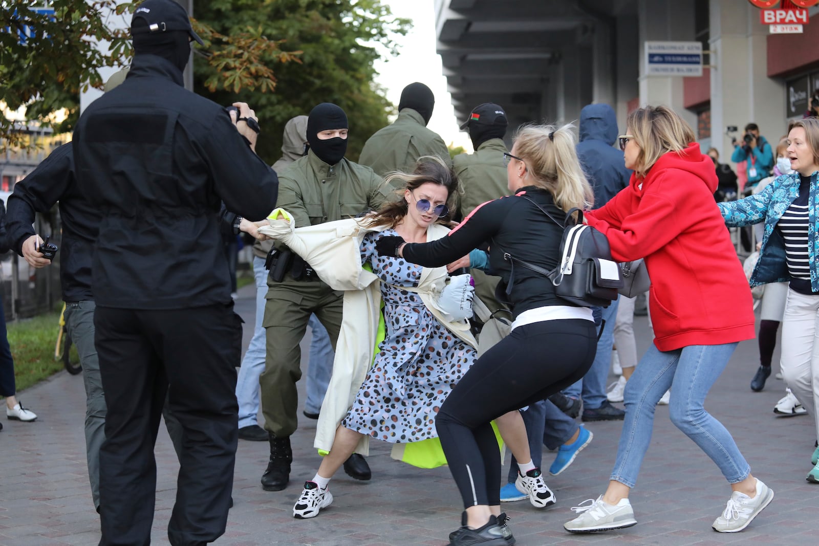 Protesters try to prevent police from detaining a demonstrator, center, during a rally in support of Maria Kolesnikova, and other members of the Coordination Council created by the opposition to facilitate talks with Lukashenko on a transition of power, was detained Monday in the capital of Minsk with two other council members, in Minsk, Belarus, Wednesday, Sept. 9, 2020. The leading opposition candidate in Belarus' disputed presidential election said Wednesday that the political tension in her country should be solved internally, by the Belarusian people, but she did not exclude the need for future international mediation. (AP Photo)