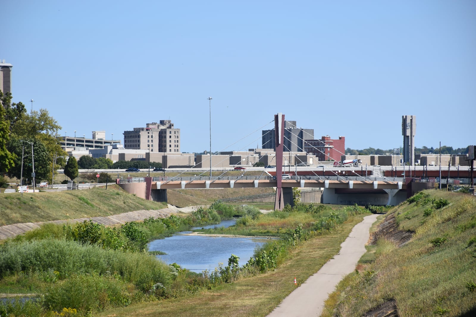 The city of Dayton plans to redesign parts of the levee flood protection systems on either side of Wolf Creek. CORNELIUS FROLIK / STAFF