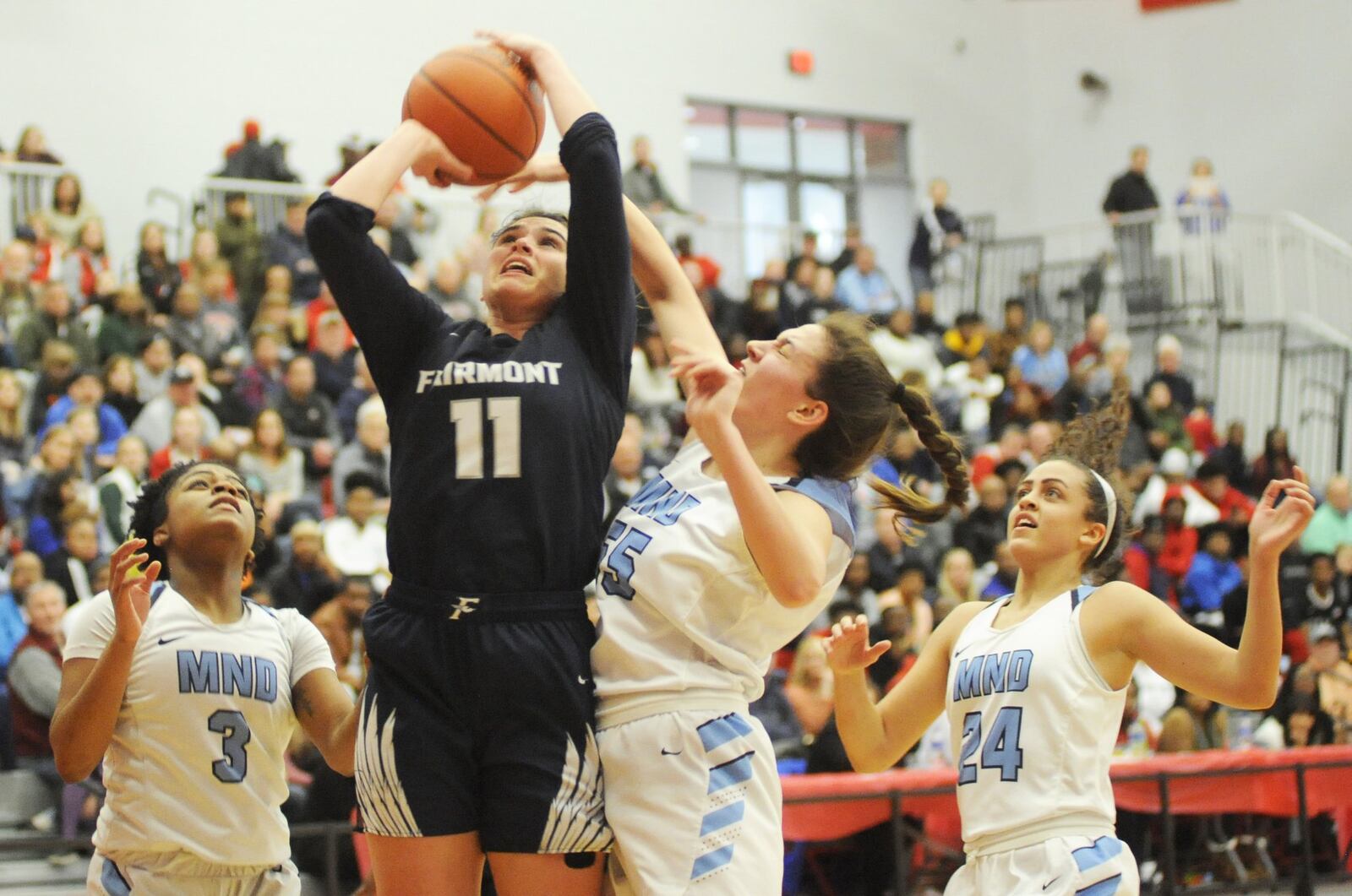 Fairmont senior Mali Morgan-Elliott gets a shot off. Fairmont played Cin. Mount Notre Dame in a girls high school basketball D-I district final at Princeton on Saturday, March 2, 2019. MARC PENDLETON / STAFF