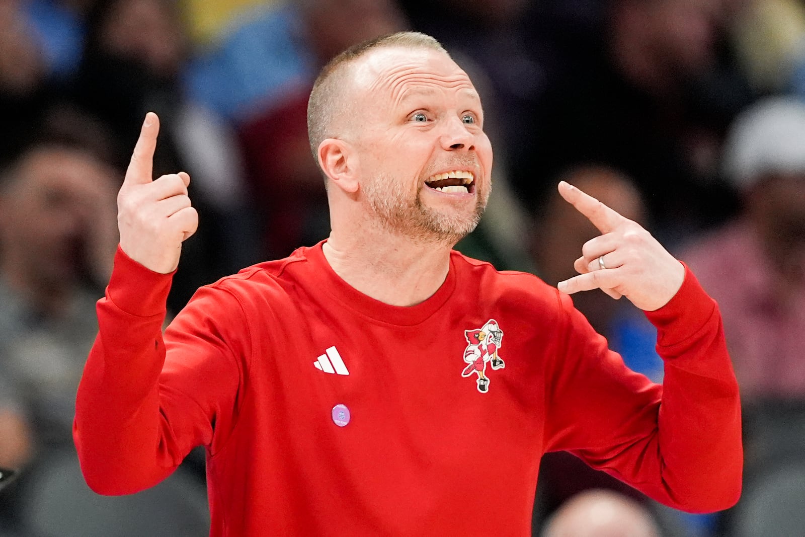 Louisville head coach Pat Kelsey watches during the first half of an NCAA college basketball game against Stanford in the quarterfinals of the Atlantic Coast Conference tournament, Thursday, March 13, 2025, in Charlotte, N.C. (AP Photo/Chris Carlson)