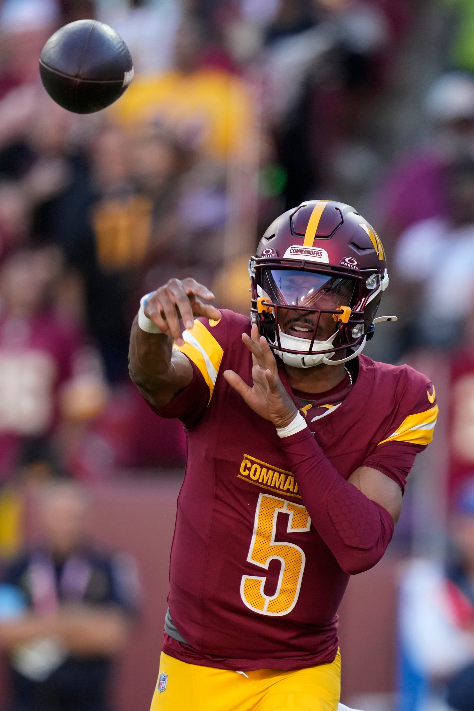 Washington Commanders quarterback Jayden Daniels throws a pass during the first half of an NFL football game against the Carolina Panthers, Sunday, Oct. 20, 2024, in Landover, Md. (AP Photo/Stephanie Scarbrough)