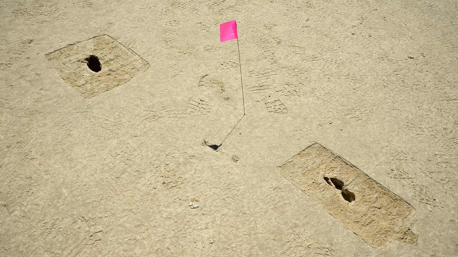 Footprints discovered on an archaeological site are marked with a pin flag on the Utah Test and Training Range on July 18. U.S. AIR FORCE PHOTO/R. NIAL BRADSHAW